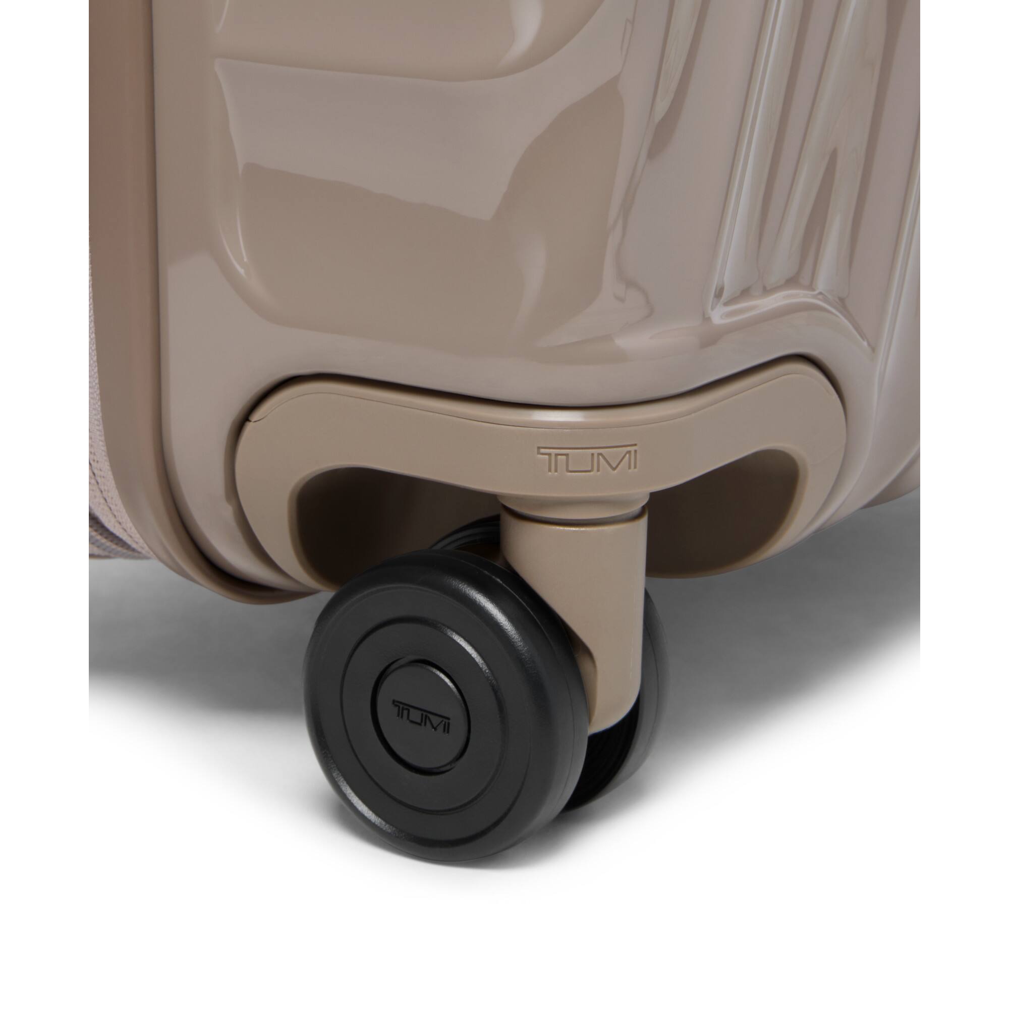 The text on the image is "TUMI."