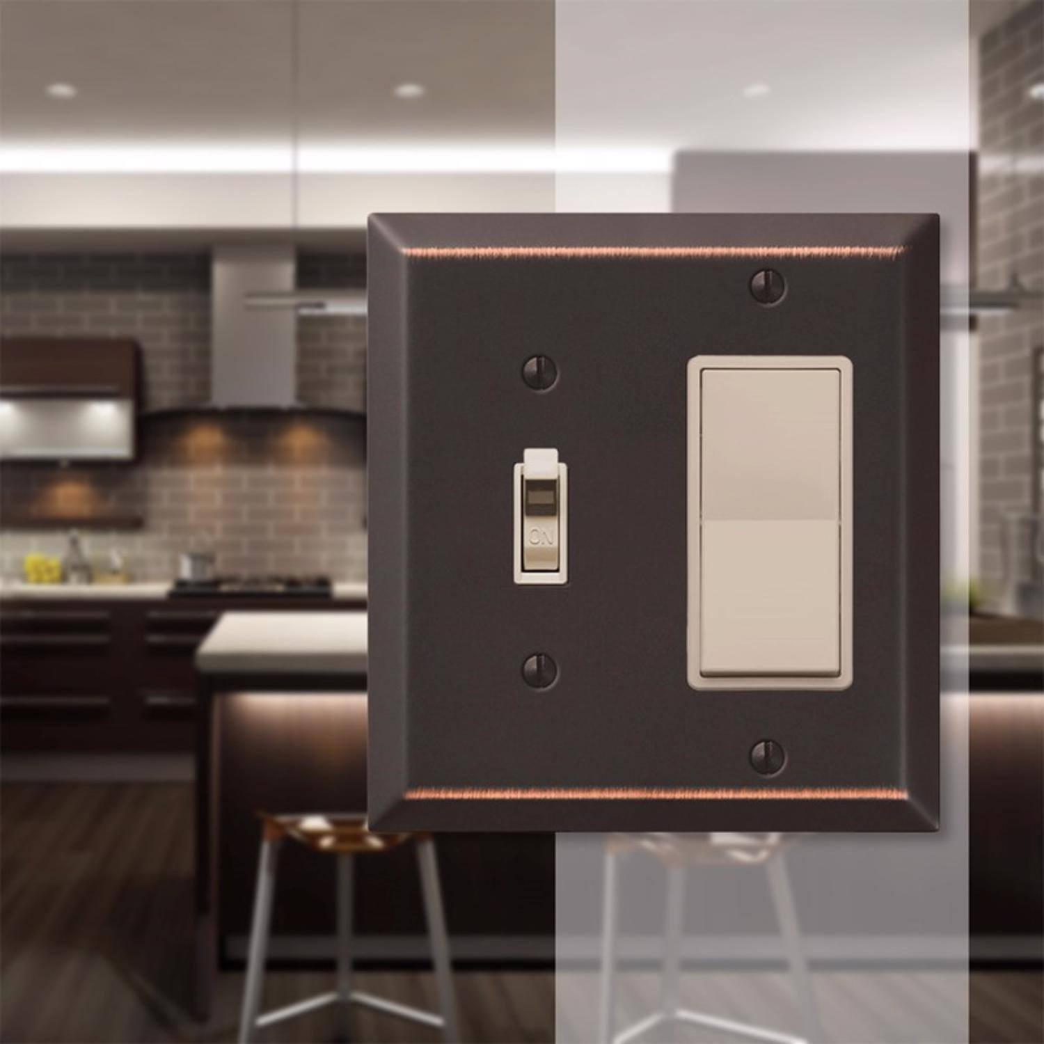 Left. AMERELLE - Amerelle Century Aged Bronze 2 gang Stamped Steel Decorator/Toggle Wall Plate 1 pk - Bronze.