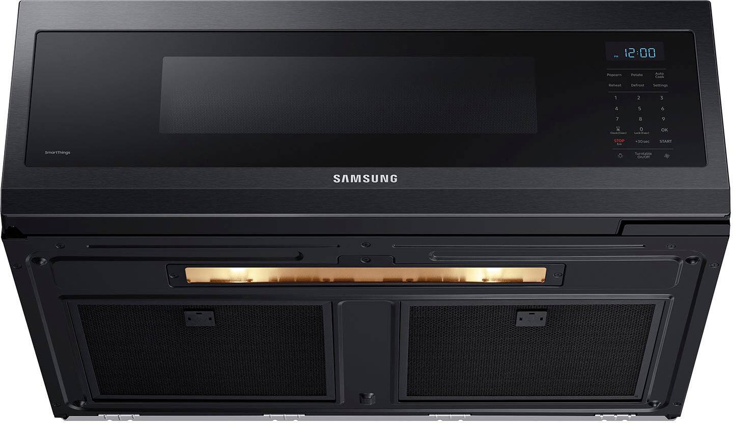 The text on the image reads:

12:00 Popcorn Potato Auto Conk Reheal Defrost Settings 1 2 3 4 5 6 7 8 9 R 0 TUSIANS SS OK STOP +30ser STANT SmartThings Turntable CAOR SAMSUNG