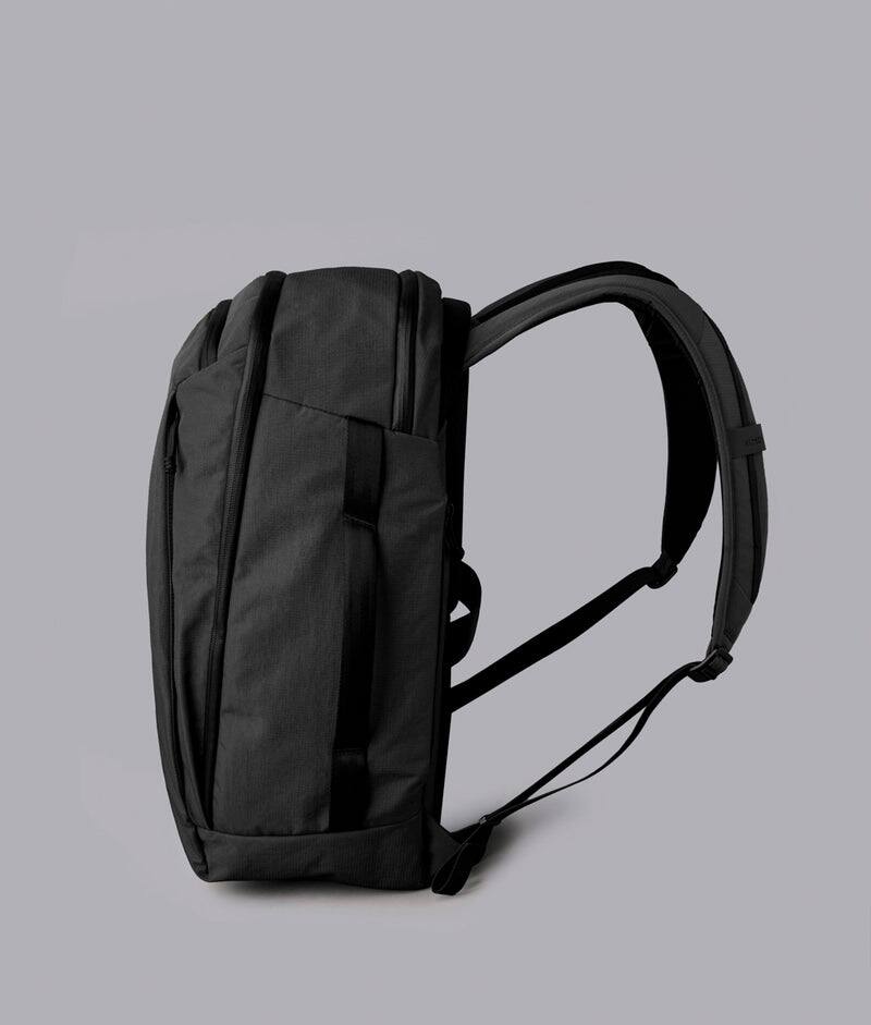 Left. ALPAKA - Traverse Backpack Laptop Backpack for Men, Backpack with Laptop Compartment (16"), Clamshell Travel Pack, Bottle Sleeve - Black Axoflux 400D Ripstop Nylon.