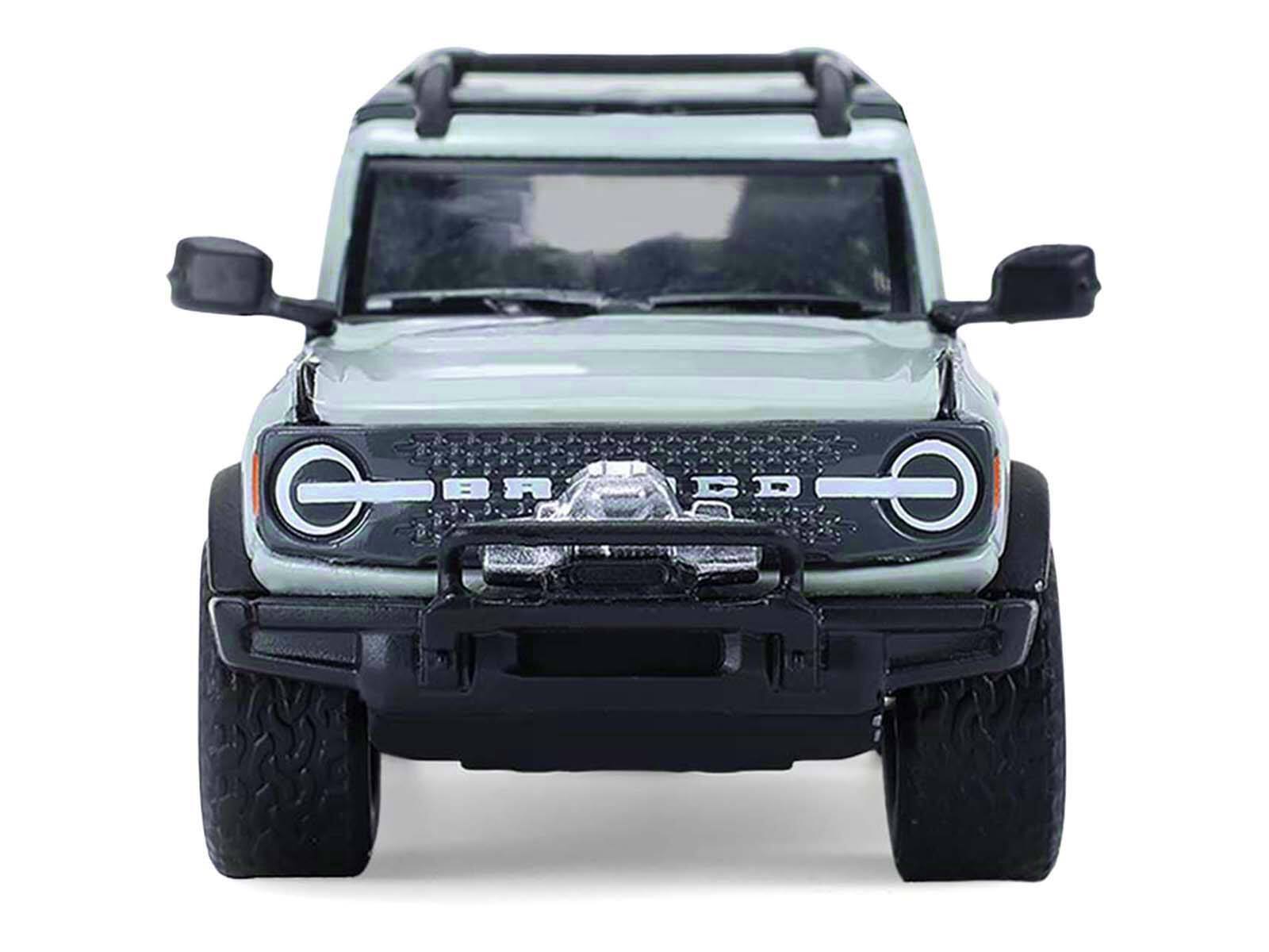 Alt View 4. Greenlight - 2021 Ford Bronco 4-Door Badlands Cactus Gray with Black Top and Motorcycle with Trailer 1/64 Model Cars by Greenlight.