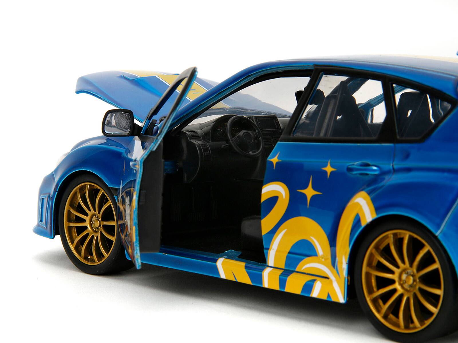 Back. Jada - 2012 Subaru Impreza WRX STI Blue Metallic with Graphics & Sonic The Hedgehog Diecast Figure 1/24 Hollywood Rides - Blue Metallic.