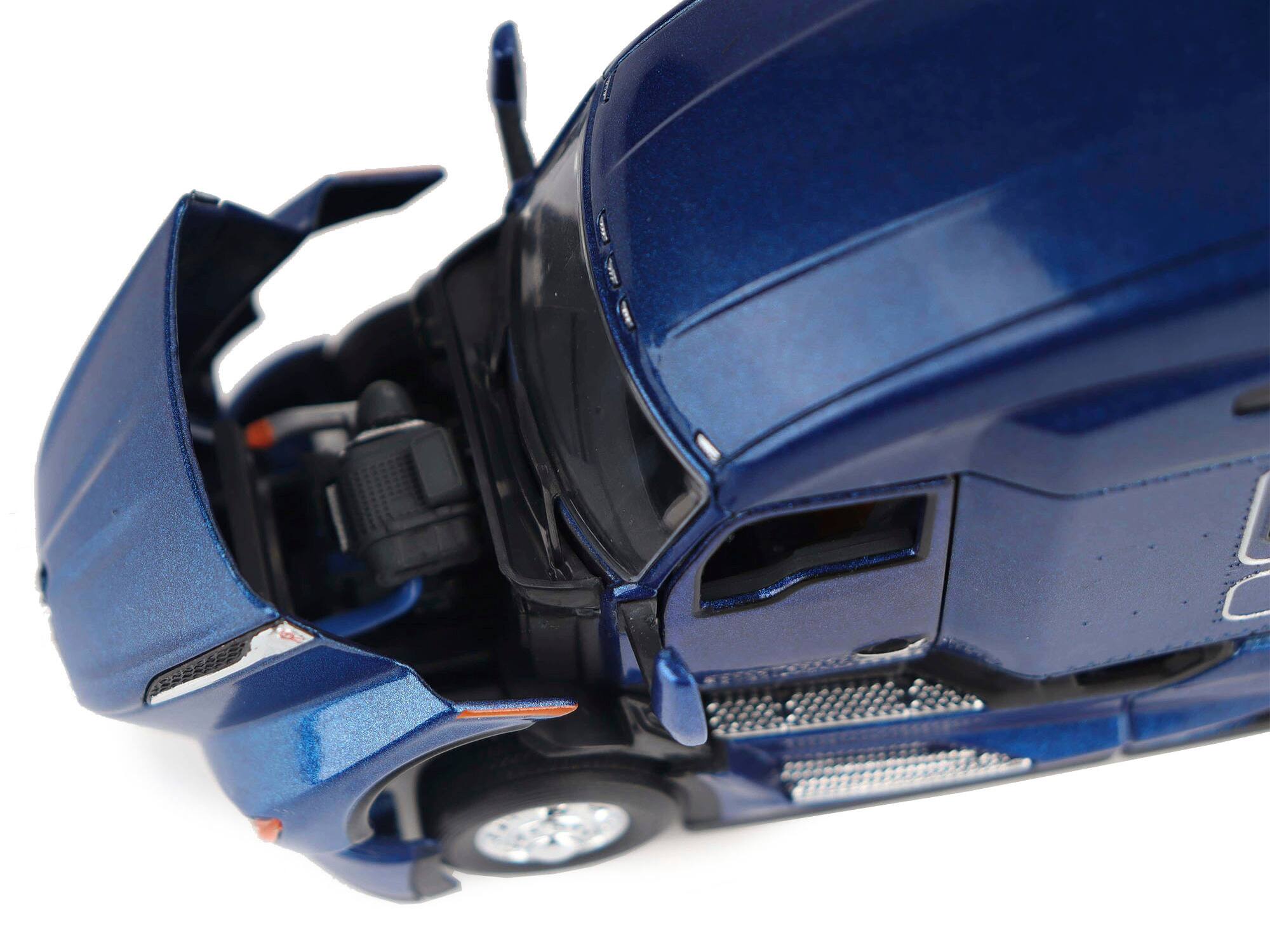 Angle. Diecast Masters - Kenworth T680 Truck Tractor Deep Cerulean Blue Metallic "Transport Series" 1/50 Diecast Model by Diecast Masters - Metallic  Blue.