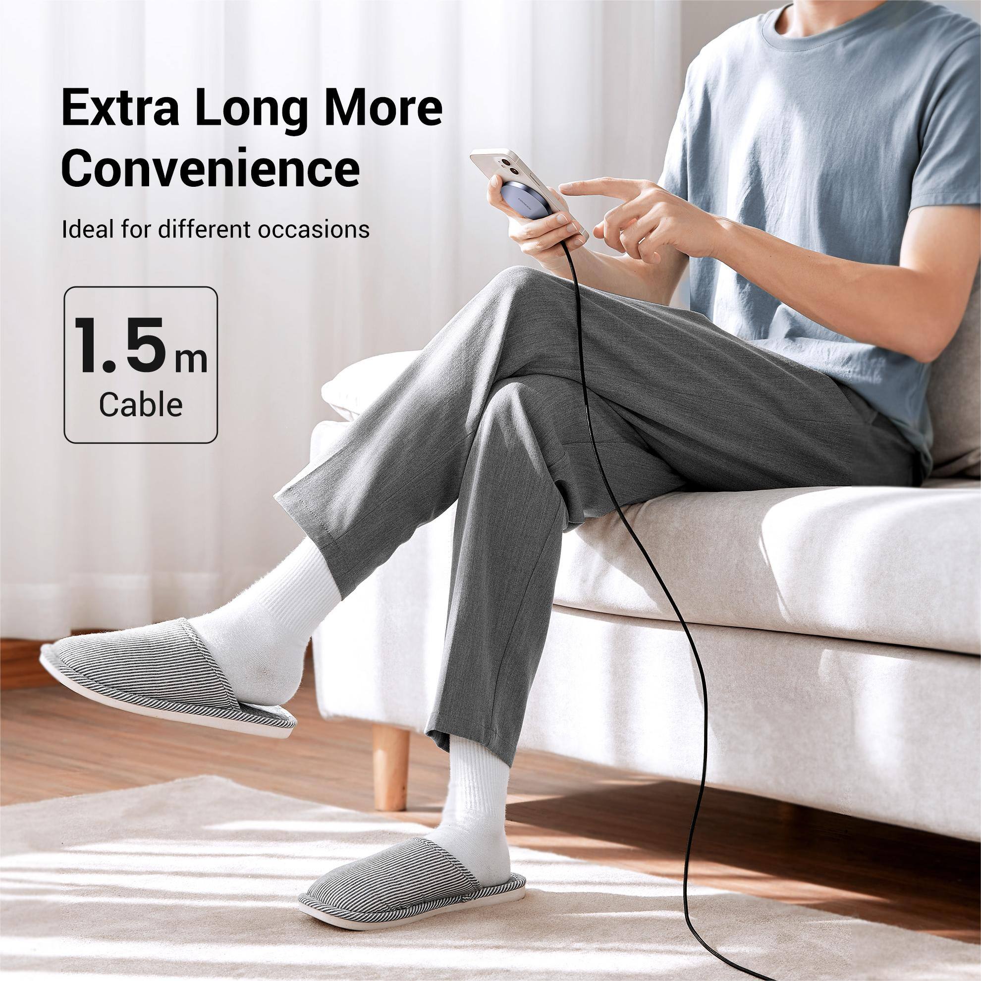 The image features a man sitting on a couch, holding a cell phone. The text on the image reads "Extra Long More Convenience Ideal for different occasions 1.5m m Cable." This suggests that the man is using a device with a long cable, which offers extra convenience and is suitable for various situations.