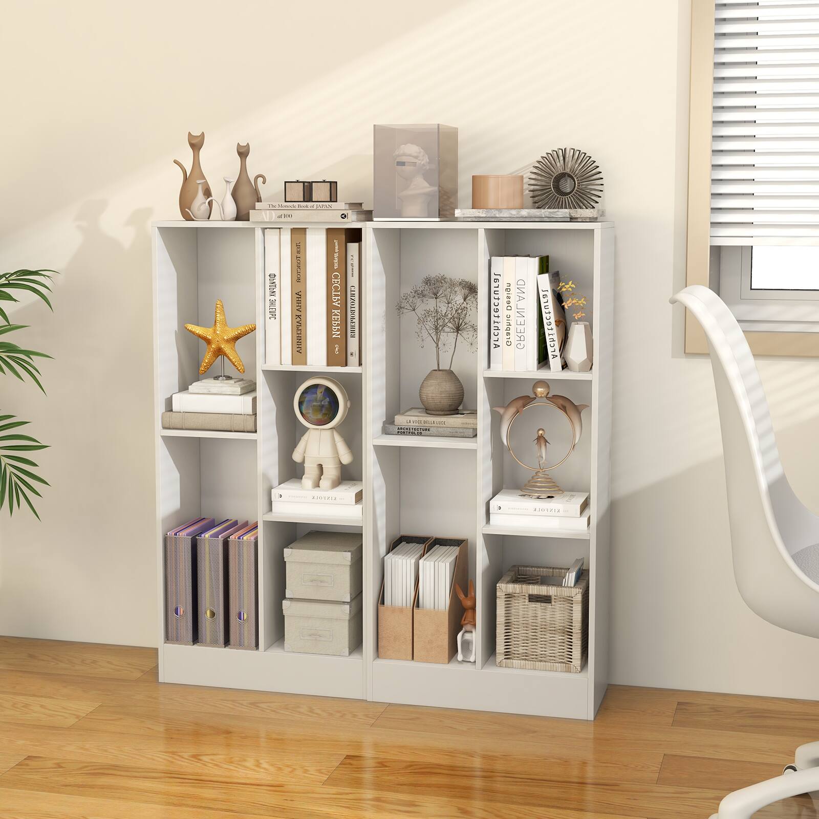 The image features a white bookshelf filled with various books, decorative items, and a starfish. The books are arranged in a neat and organized manner, showcasing a diverse collection. The bookshelf is situated in a room with a window, providing natural light to the space. The books on the shelf are of different sizes and colors, adding visual interest to the bookshelf. The overall scene creates a cozy and inviting atmosphere for reading and relaxation.