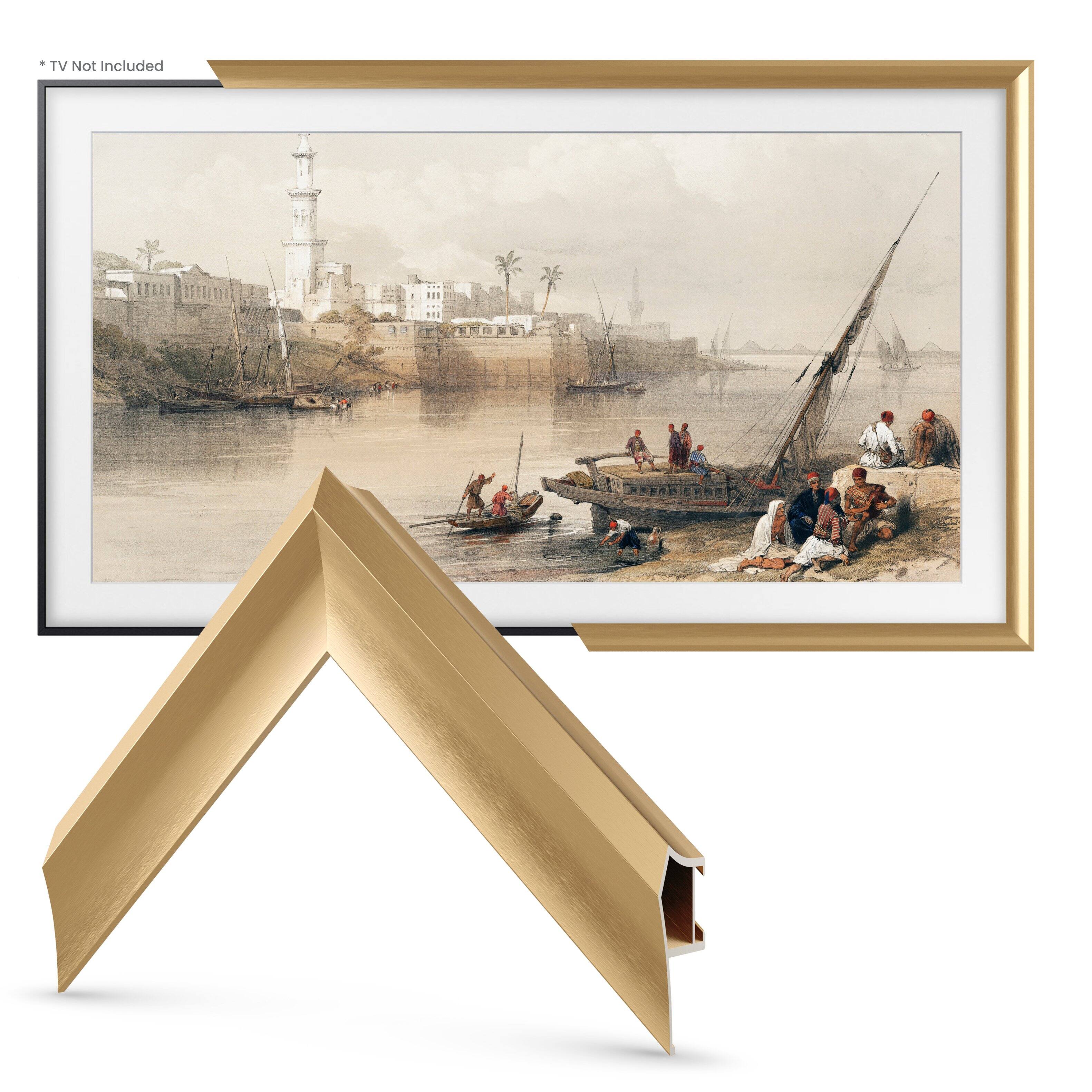 The image features a painting of a boat on water, with a group of people standing on the shore. The painting is displayed in a gold frame, which adds a touch of elegance to the artwork. The frame is open, revealing the artwork inside. The scene captures a moment of leisure and relaxation, as the people on the shore enjoy the view of the boat and the water. The painting is a beautiful representation of a peaceful moment in nature, and the gold frame enhances its visual appeal.