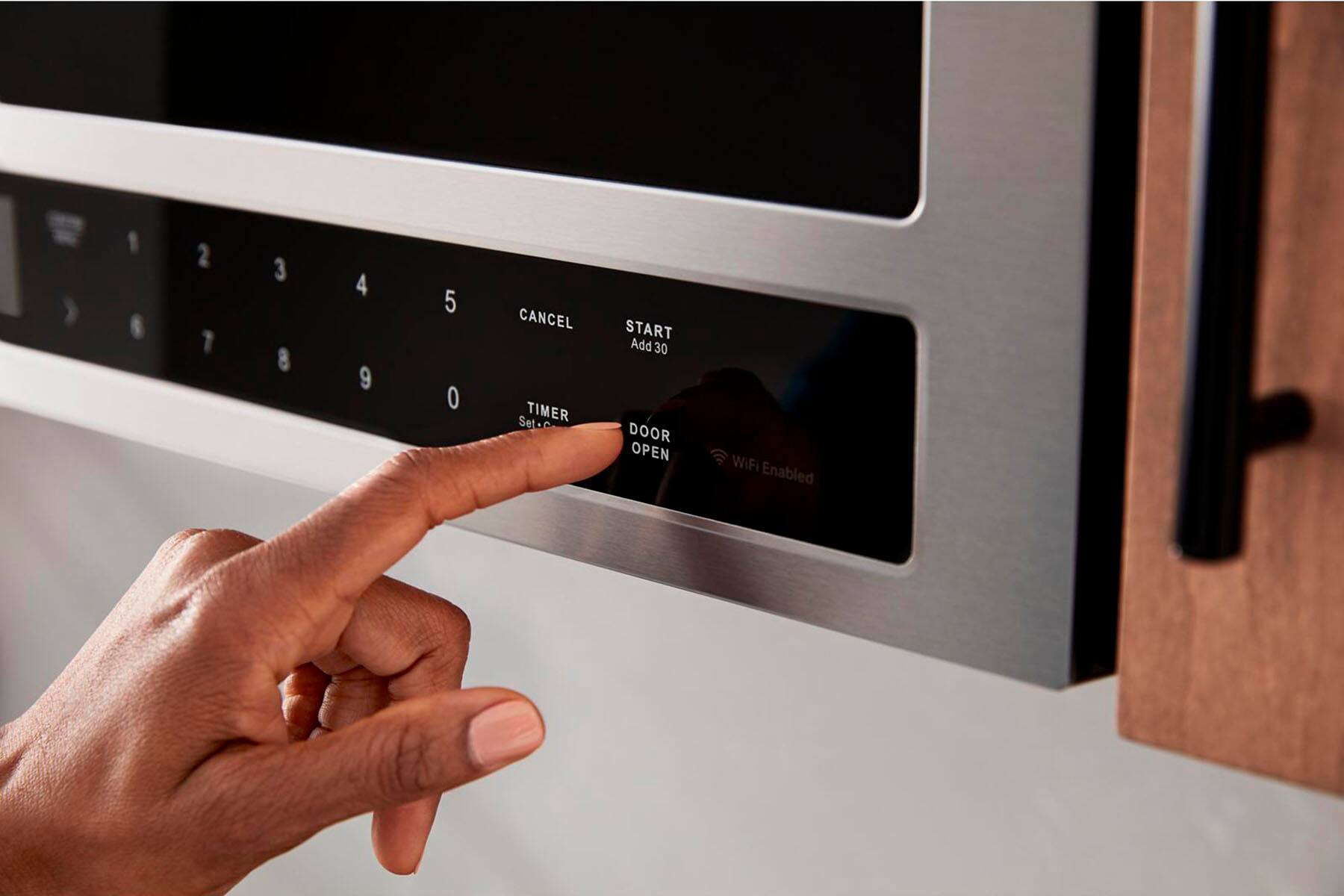 The text on the image reads:

1 6 2 7 3 8 4 9 5 O CANCEL TIMER SetC START Add 30 DOOR OPEN WiFi Enabled

Corrected text:

1 6 2 7 3 8 4 9 5 O CANCEL TIMER SetC START Add 30 DOOR OPEN WiFi Enabled