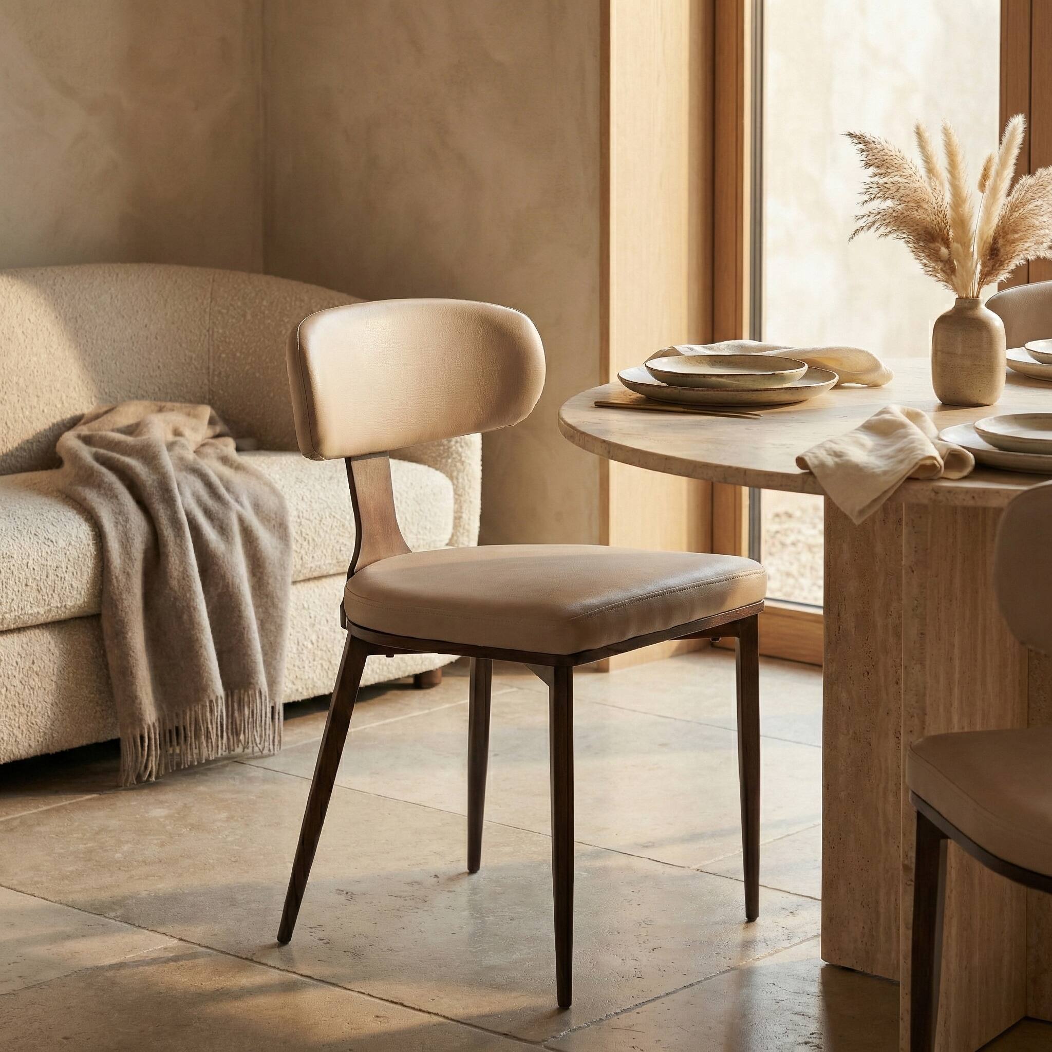 Angle. LeisureMod - Dilenny Modern Upholstered Leather Dining Chair with Tapered Powder-Coated Steel Legs & Curved Back - Taupe.