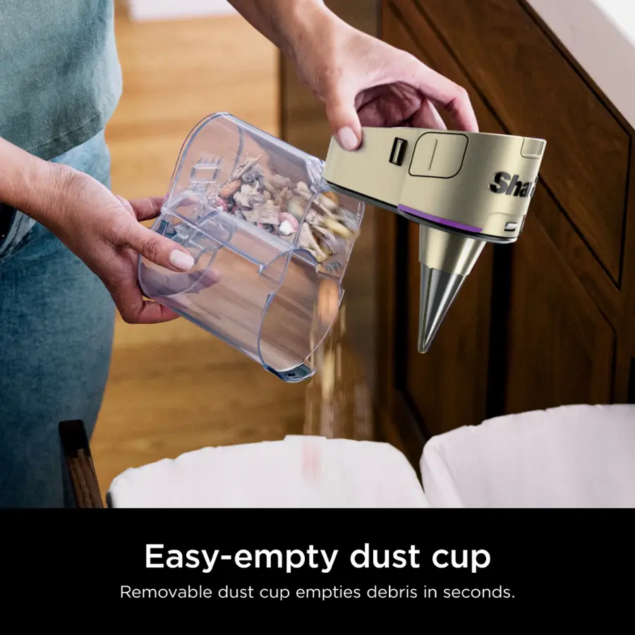 The text on the image reads: "Easy-empty dust cup Removable dust cup empties debris in seconds."