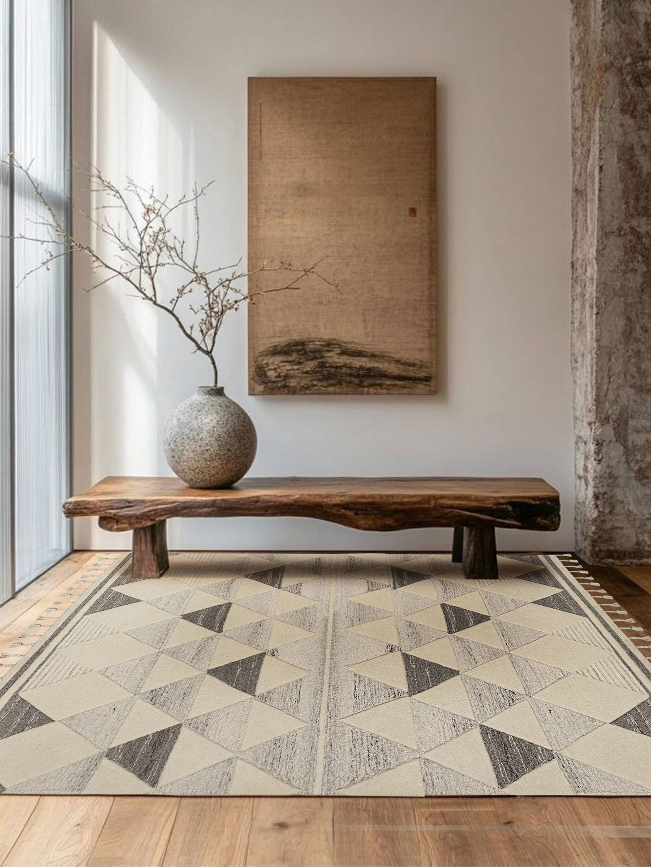 Left. GAURI KOHLI - Okinawa Rug - Shades of ivory, beige and brown.