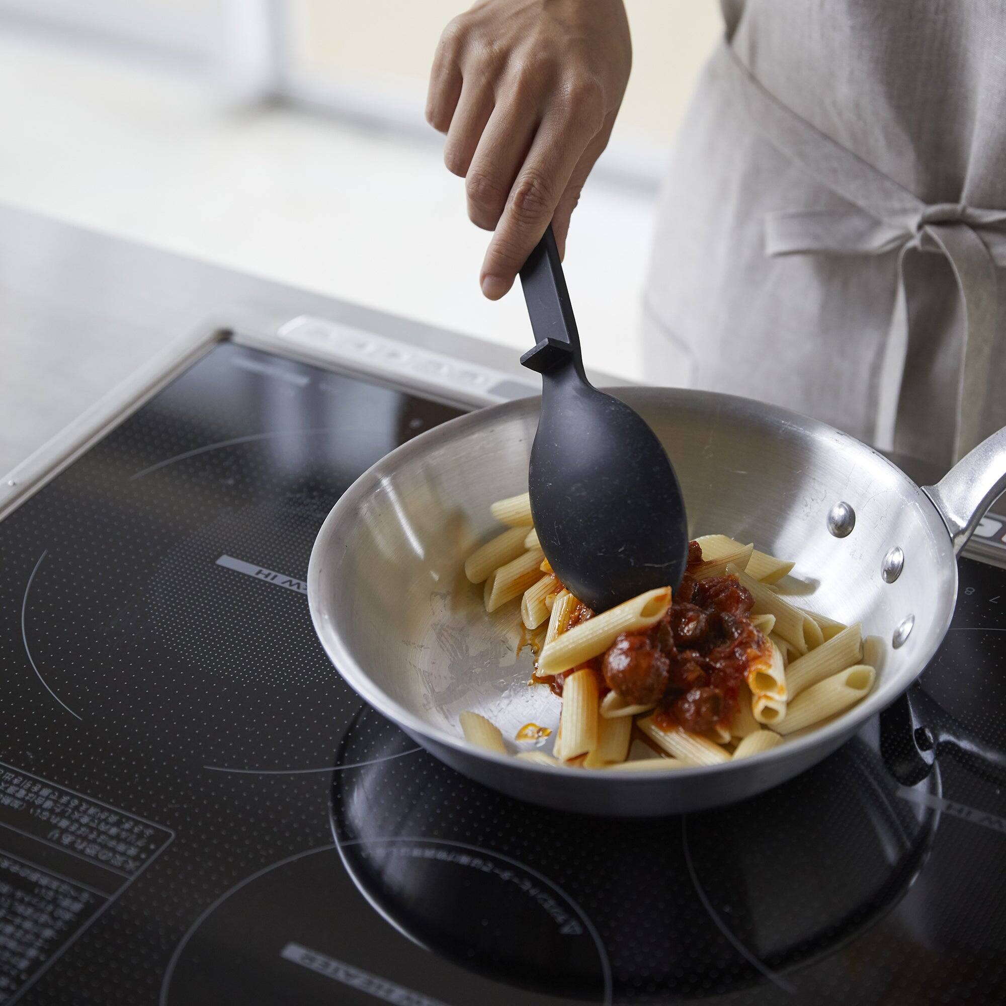 Left. Yamazaki Home - Floating Cooking Spoon - Silicone - Black.