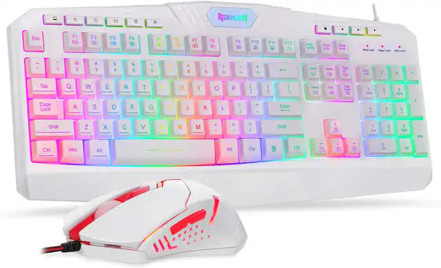 The image features a white keyboard and mouse from the brand REDRAGON. The keyboard has a colorful design, with a mix of white and rainbow colors. The mouse is also white and is placed next to the keyboard. The keyboard is equipped with a variety of function keys, including F1 to F12, as well as other essential keys such as the arrow keys, number pad, and various other keys. The combination of the colorful keyboard and mouse creates a visually appealing and unique setup.
