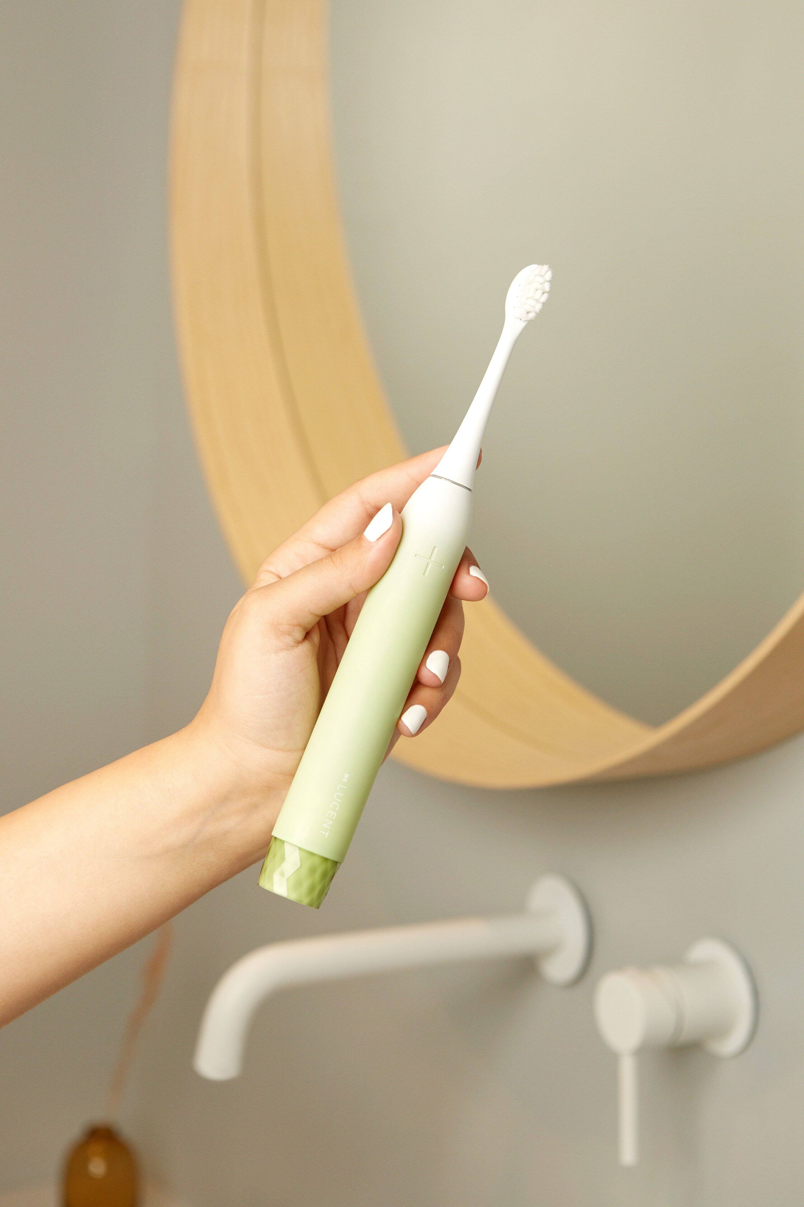 Alt View 1. Be Lucent - Sonic Electric Toothbrush that look cosmetically appealing with 3 brush modes.  Last up to 60 days before charging. - Mint.