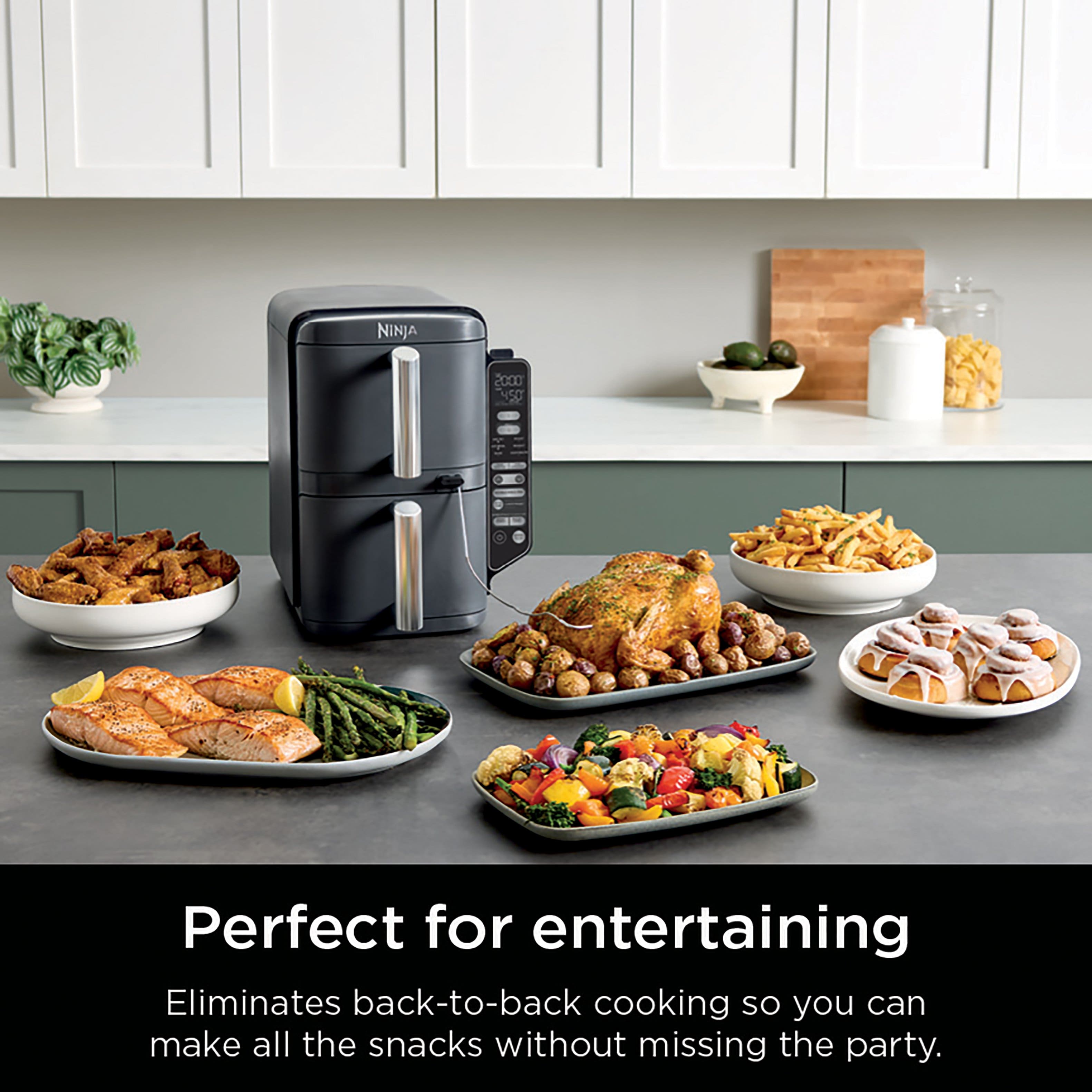 The text on the image reads: "NINJA 2000 NEO Perfect for entertaining Eliminates back-to-back cooking so you can make all the snacks without missing the party."