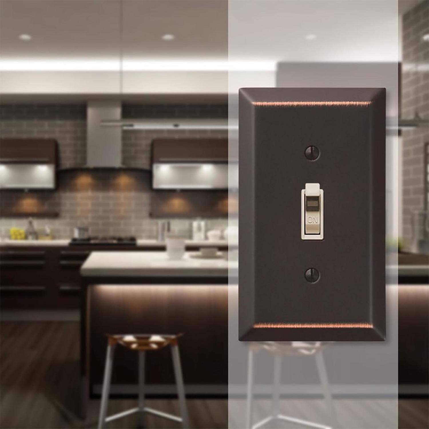 Left. AMERELLE - Amerelle Century Aged Bronze 1 gang Stamped Steel Toggle Wall Plate 1 pk - Bronze.