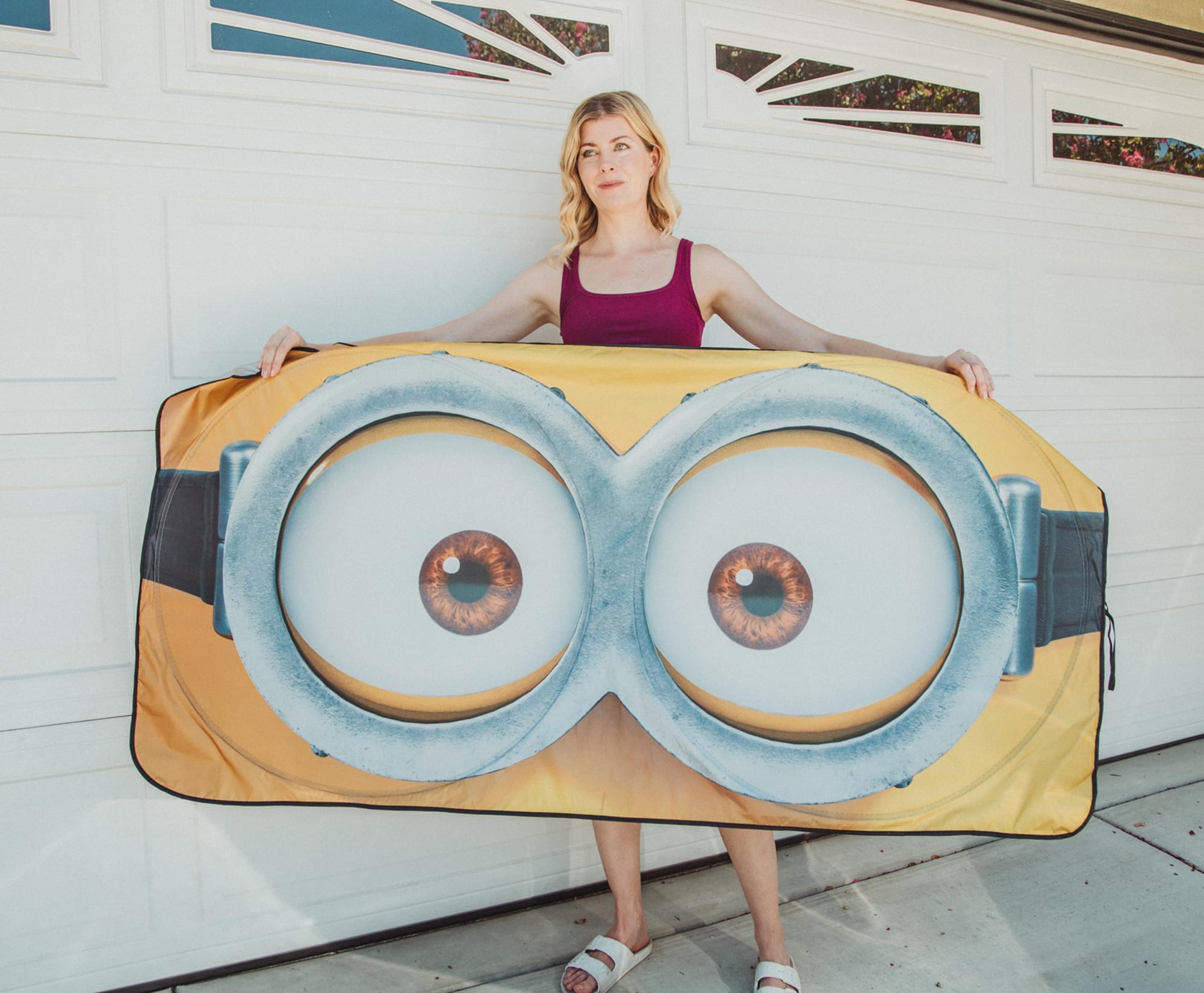 Alt View 3. Surreal Entertainment - Despicable Me Minions Face Sunshade for Car Windshield | 64 x 32 Inches - Yellow.