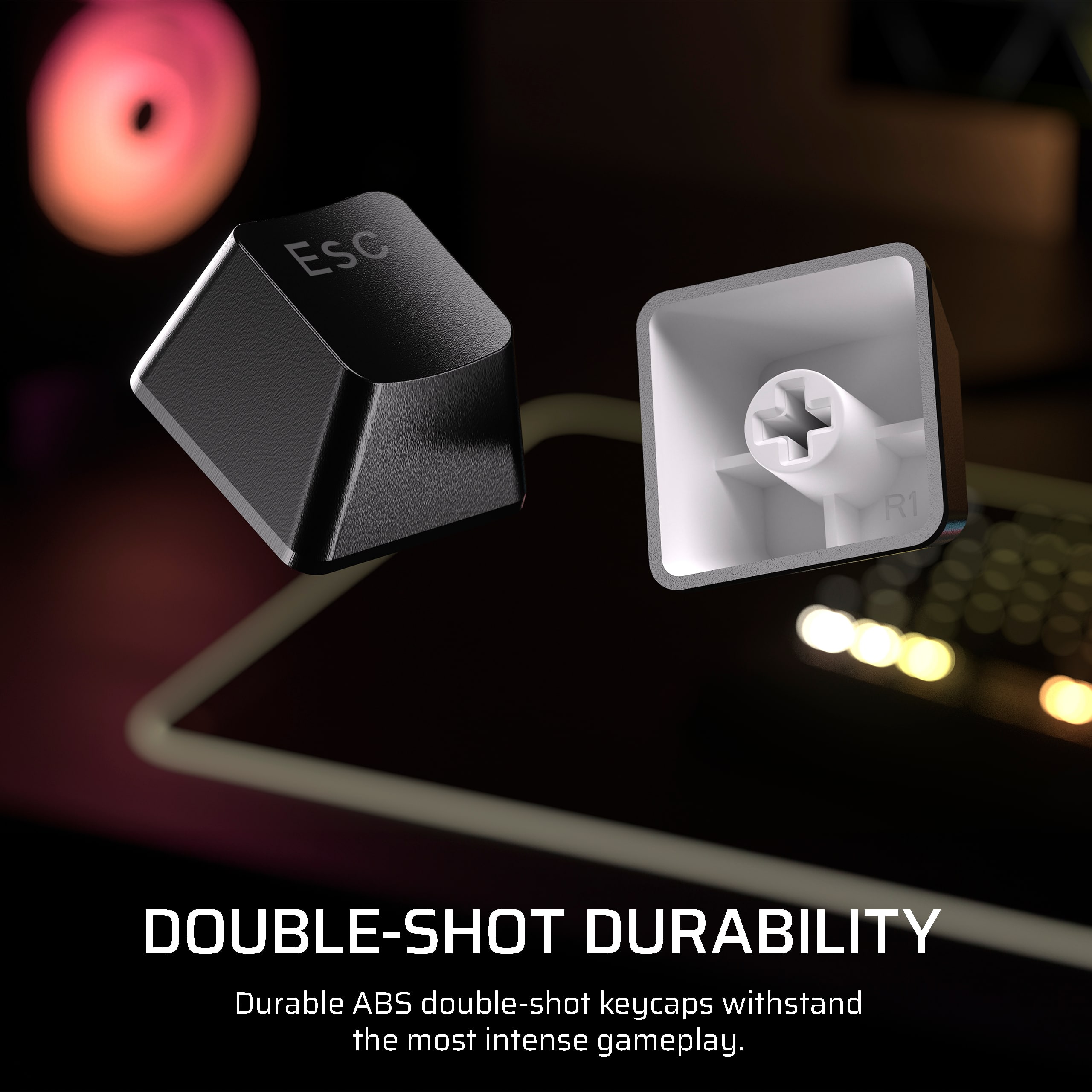 The text on the image reads: "EsC R1 DOUBLE-SHOT DURABILITY Durable ABS double-shot keycaps withstand the most intense gameplay."