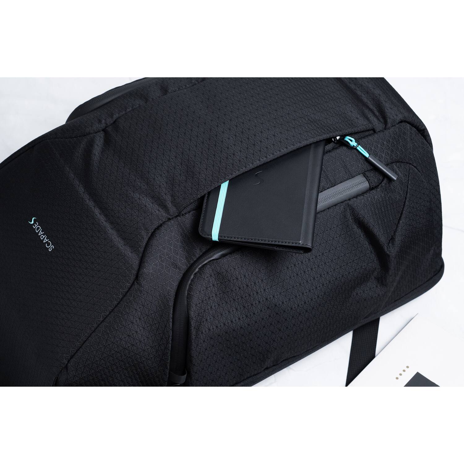 Left. Scapade - AirPack BackPack with Find My Tracker, TSA-Approved Lock - Black.