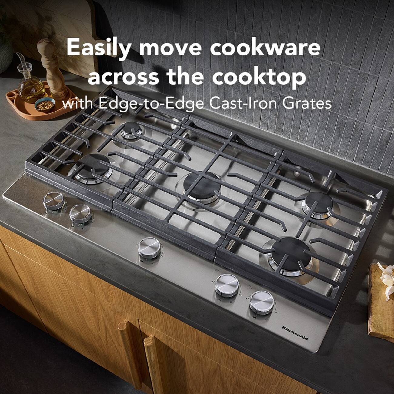 Easily move cookware across the cooktop with Edge-to-Edge Cast-Iron Grates