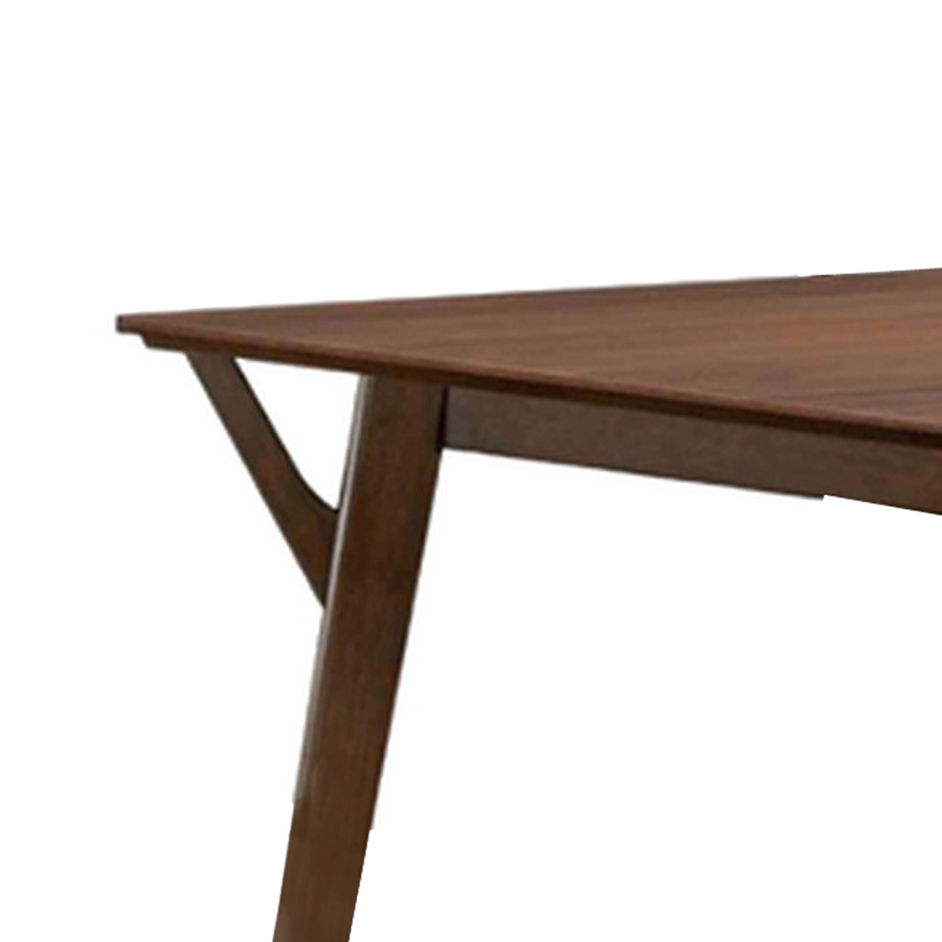 Alt View 2. Manhattan Lane - Skie Dining Table, 59 Inch Rectangular Top, Angled Legs, Brown Solid Wood - Walnut Brown.