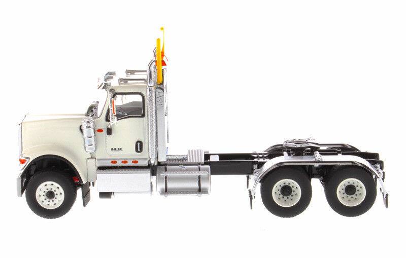 Left. Diecast Masters - International HX520 Day Cab Tandem Tractor White 1/50 Diecast Model by Diecast Masters - White .