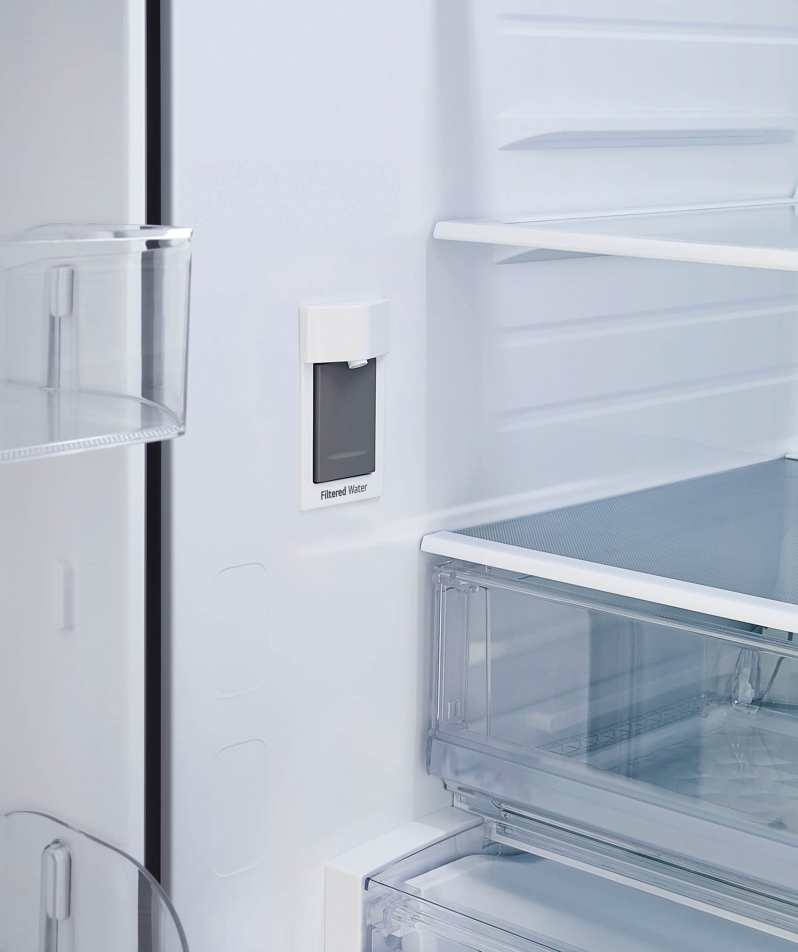 The image shows a refrigerator with a water dispenser on the door. The dispenser is designed to provide filtered water, ensuring that the water is clean and safe to drink. The refrigerator is white, and the water dispenser is located on the door, making it easily accessible for users.