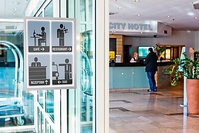 CITY HOTEL

CAFE →
RESTAURANT →

RECEPTION ↑
TAXI ←