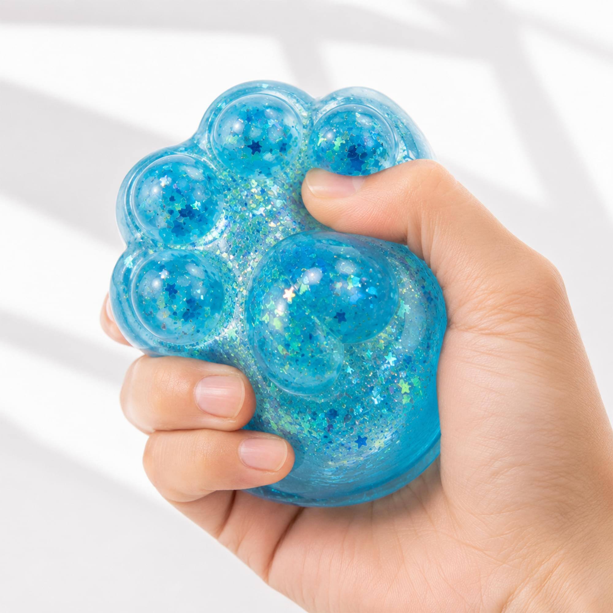 Alt View 3. Puka Creations - Glitter Cat Paw 3-Inch Squishy Stress Reliever | Blue - Blue.
