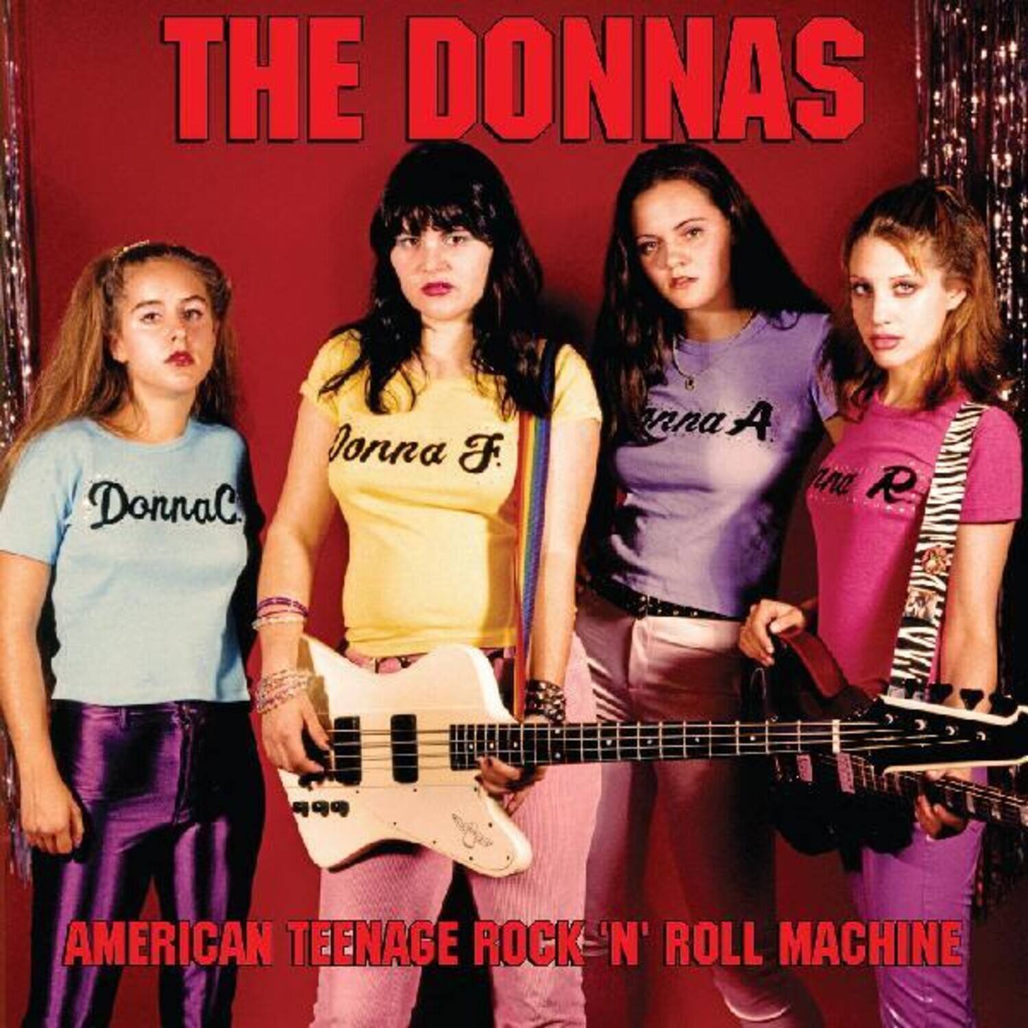 THE DONNAS

Donna C.  
Jonna F.  
Anna A.  
R.

AMERICAN TEENAGE ROCK 'N' ROLL MACHINE