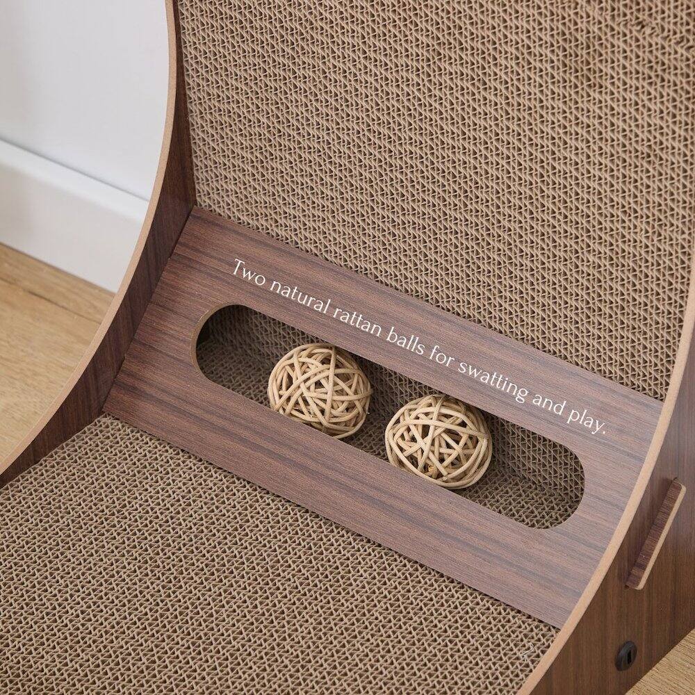 Two natural rattan balls for swatting and play.