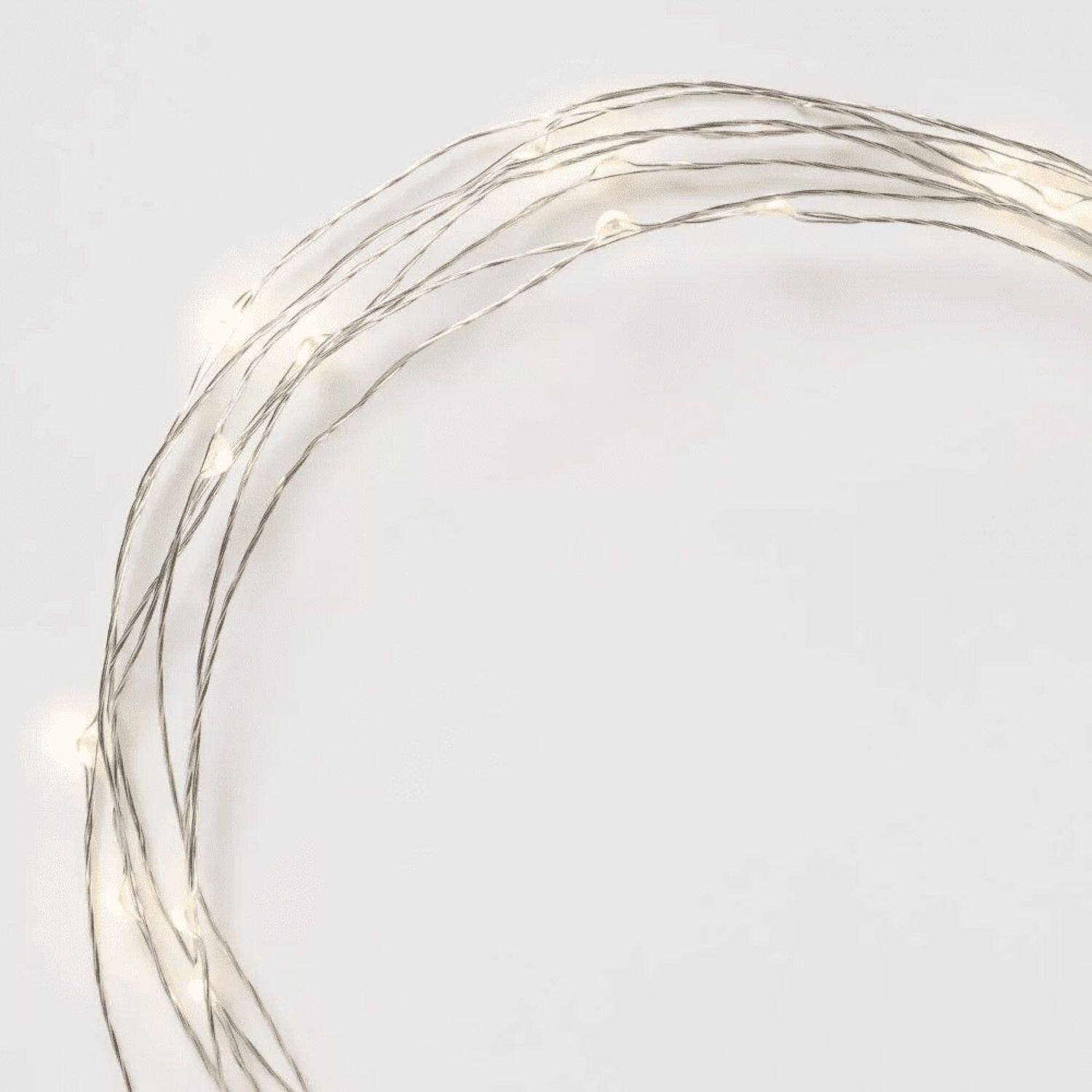 Angle. Stock Preferred - Battery Operated 25-Count LED Fairy String Lights - Metallic Silver Wire / Warm White LEDs.