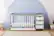 Angle. Graco - Remi 4-in-1 Convertible Crib and Changer - Pebble Gray/White.