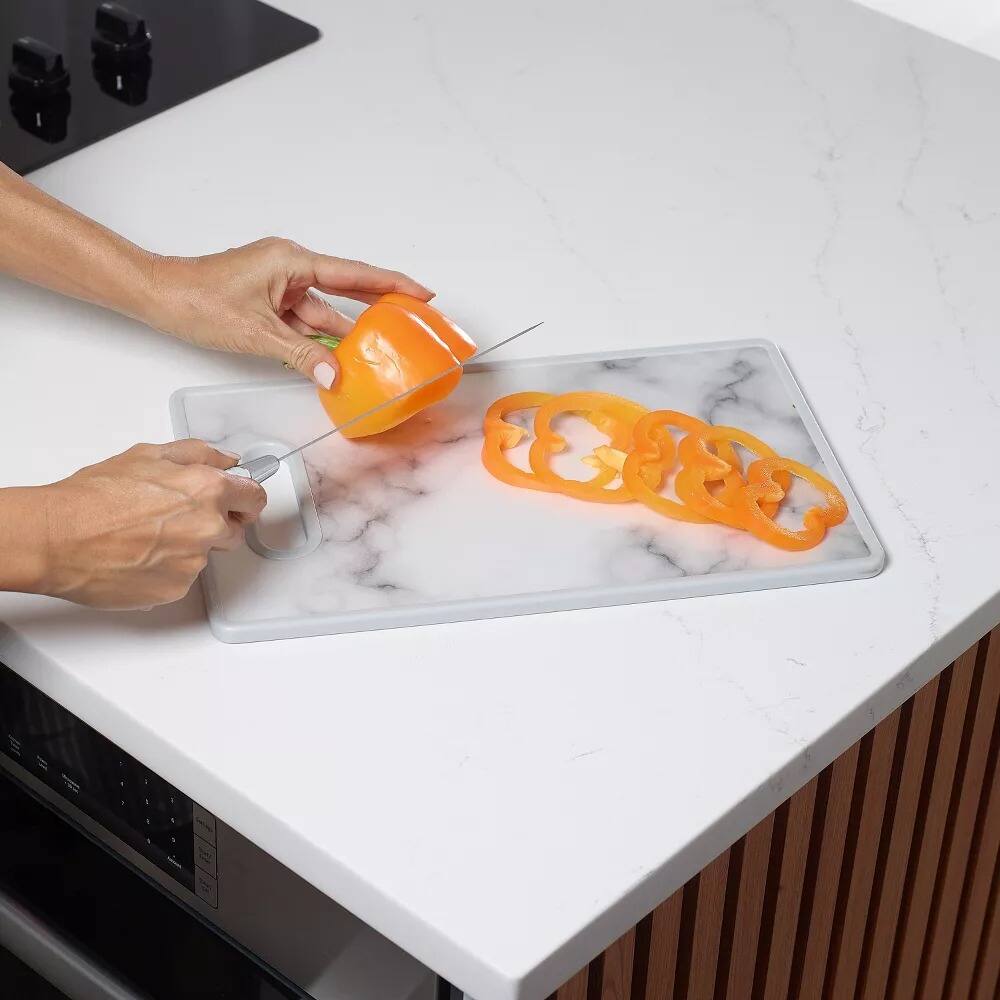 Angle. Elle Decor - 9" x 14" Kitchen Cutting Board -Marble Designed Plastic, Nonslip, Easy-Grip Handle, Dishwasher Safe - Marble.