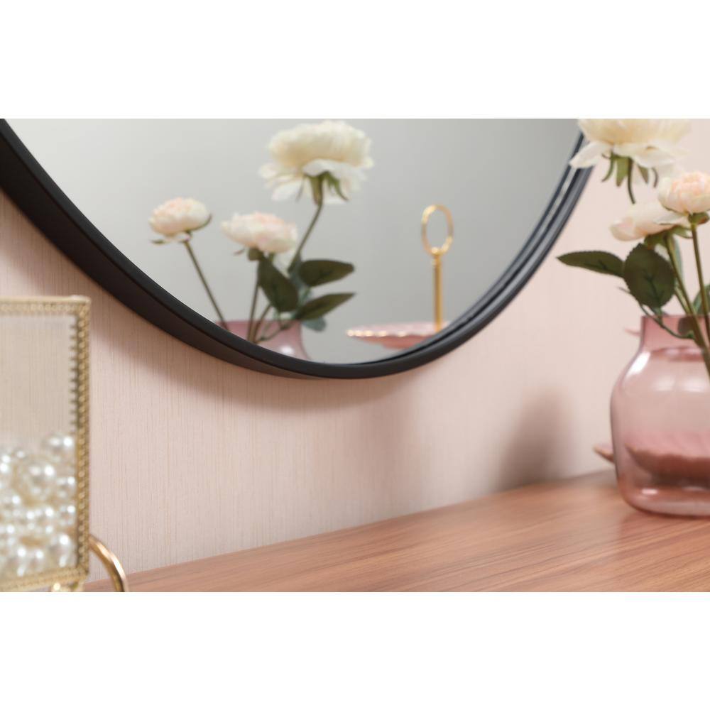 Left. Elegant Decor - Metal frame round mirror with decorative hook 45 inch in Black - Black.