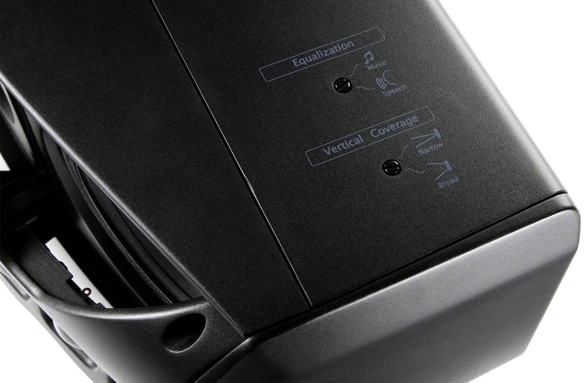 The image shows a black device with a label on it that reads "Equalization J Music Speech Coverage Vertical Narrow Broad." This label indicates that the device is designed to provide equalization for different types of audio content, such as music, speech, and coverage for both narrow and broad frequency ranges. The device may be a speaker, microphone, or audio processing unit, and its purpose is to enhance the audio quality and provide a better listening experience for users.