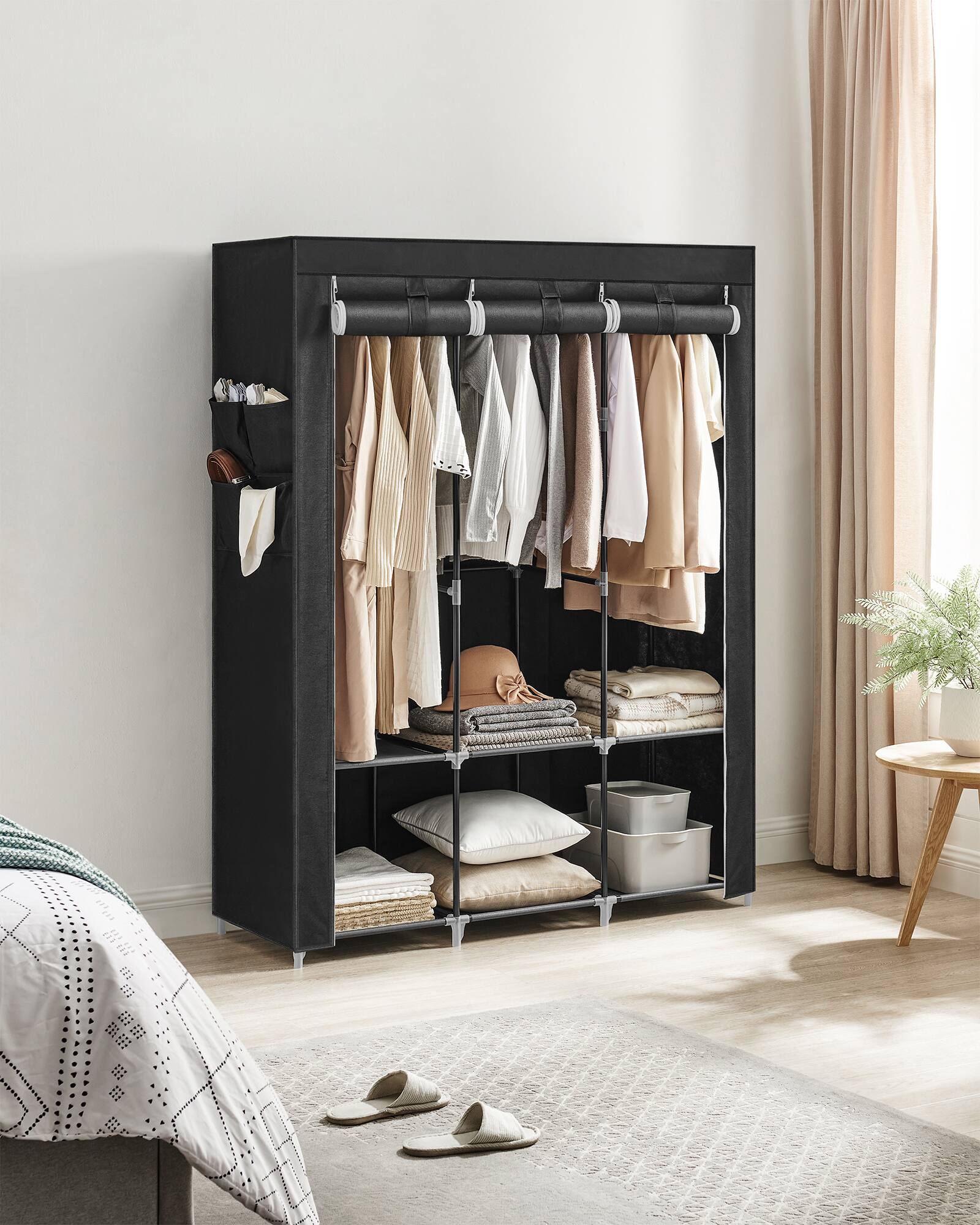 Angle. Songmics Home - Portable Closet, Wardrobe Closet Organizer with Cover, 3 Hanging Rods and Shelves, 4 Side Pockets - Ink Black.