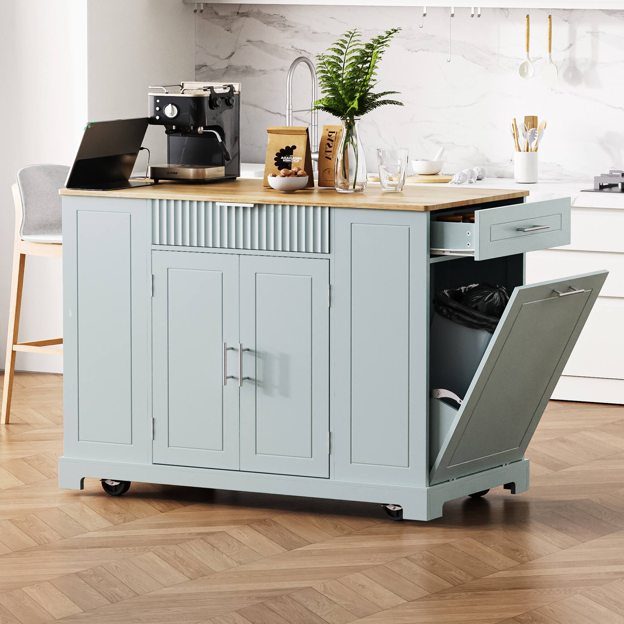 Angle. GOODSILO - Kitchen Island with Trash Can Storage, Power Outlet, Rolling Wheels, 3 Drawers & Open Shelves - Grey+Blue.