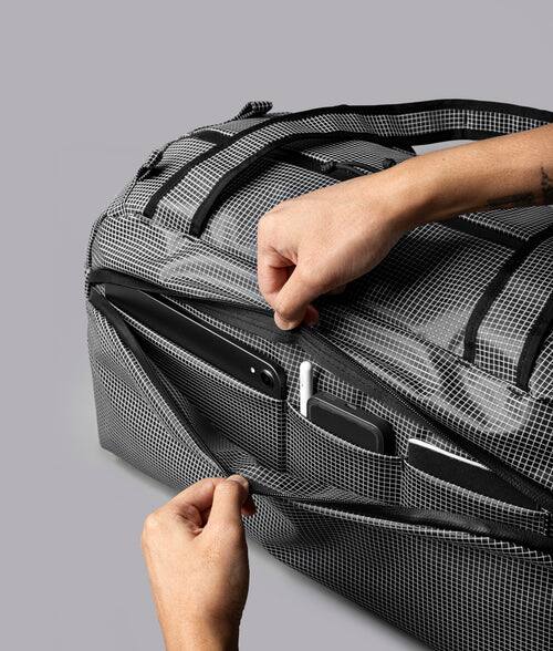 Alt View 6. ALPAKA - 35L Lightweight Duffel Bag for Gym, Weekend Trips & Carry-On Travel, Momentum Duffel, Weather-Resistant - Axodyne hybrid Grey.