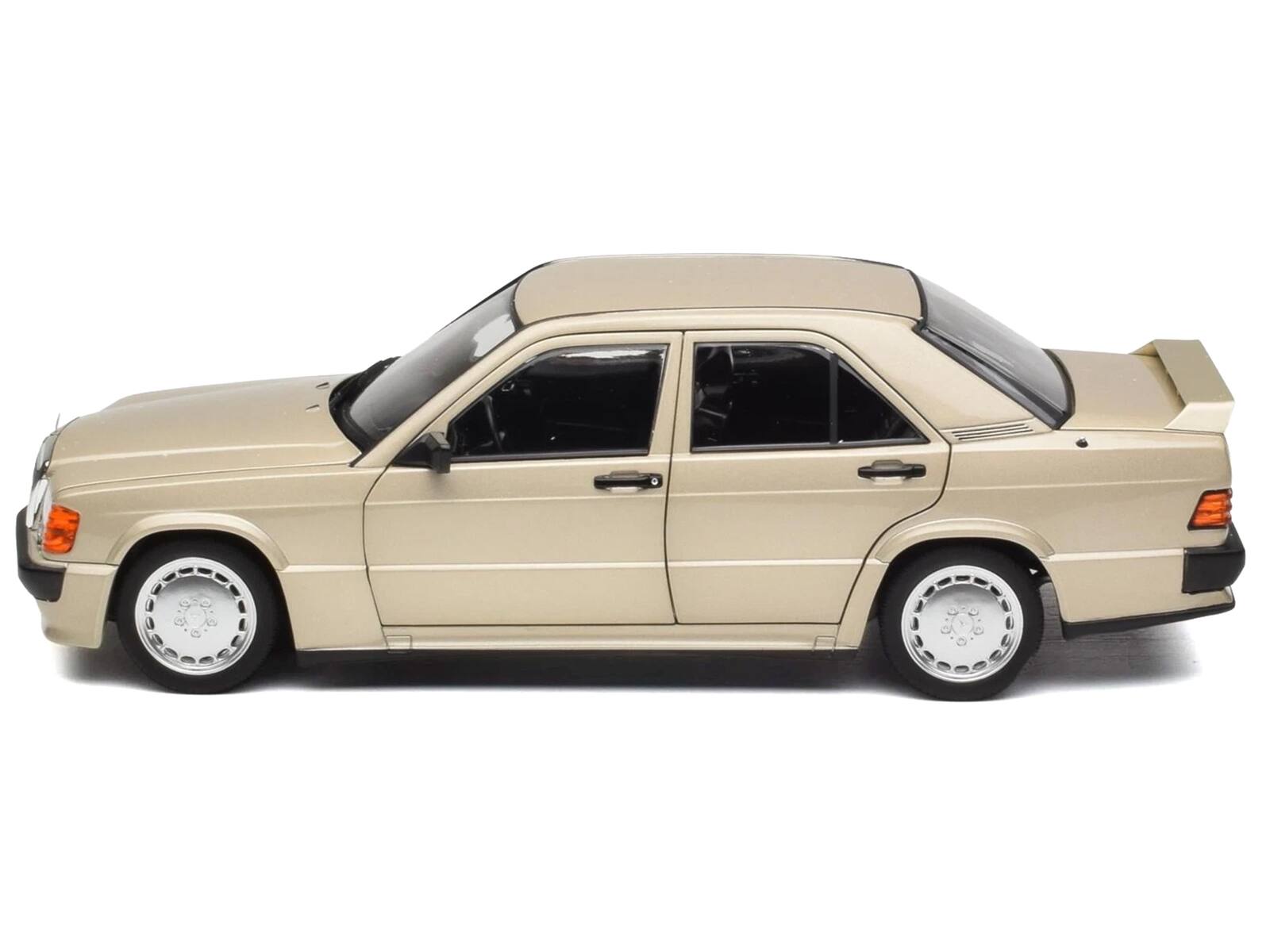 Left. Norev - 1984 Mercedes-Benz 190E 2.3-16 Smoke Silver Metallic 1/18 Diecast Model Car by Norev - Silver Metallic.