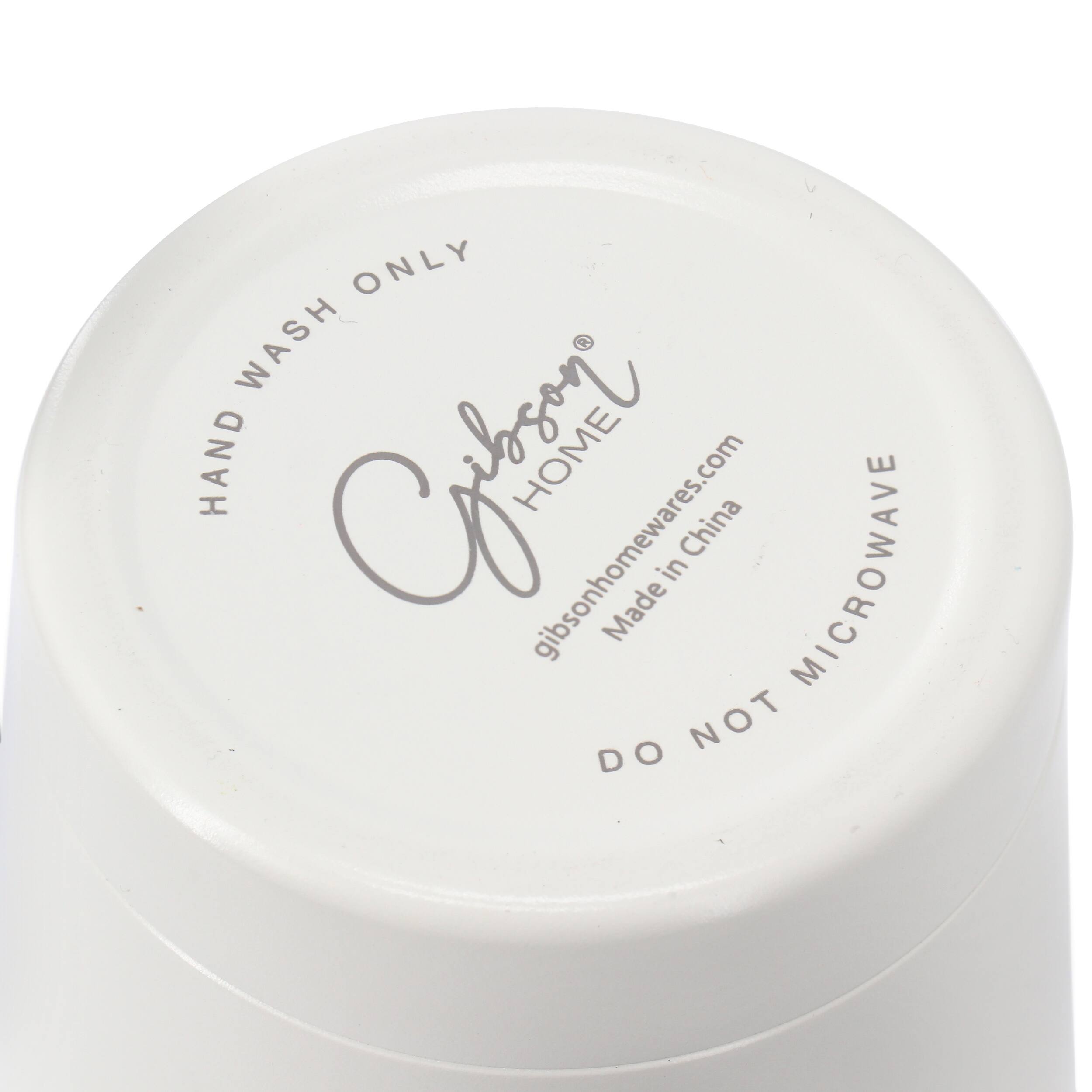 The text on the image reads "Hand Wash Only Wash Hand Clean Home gibsonhomewares.com China in Microwave Made NOT DO." This text is grouped and corrected as follows:

"Hand Wash Only Wash Hand Clean Home gibsonhomewares.com China in Microwave Made NOT DO."