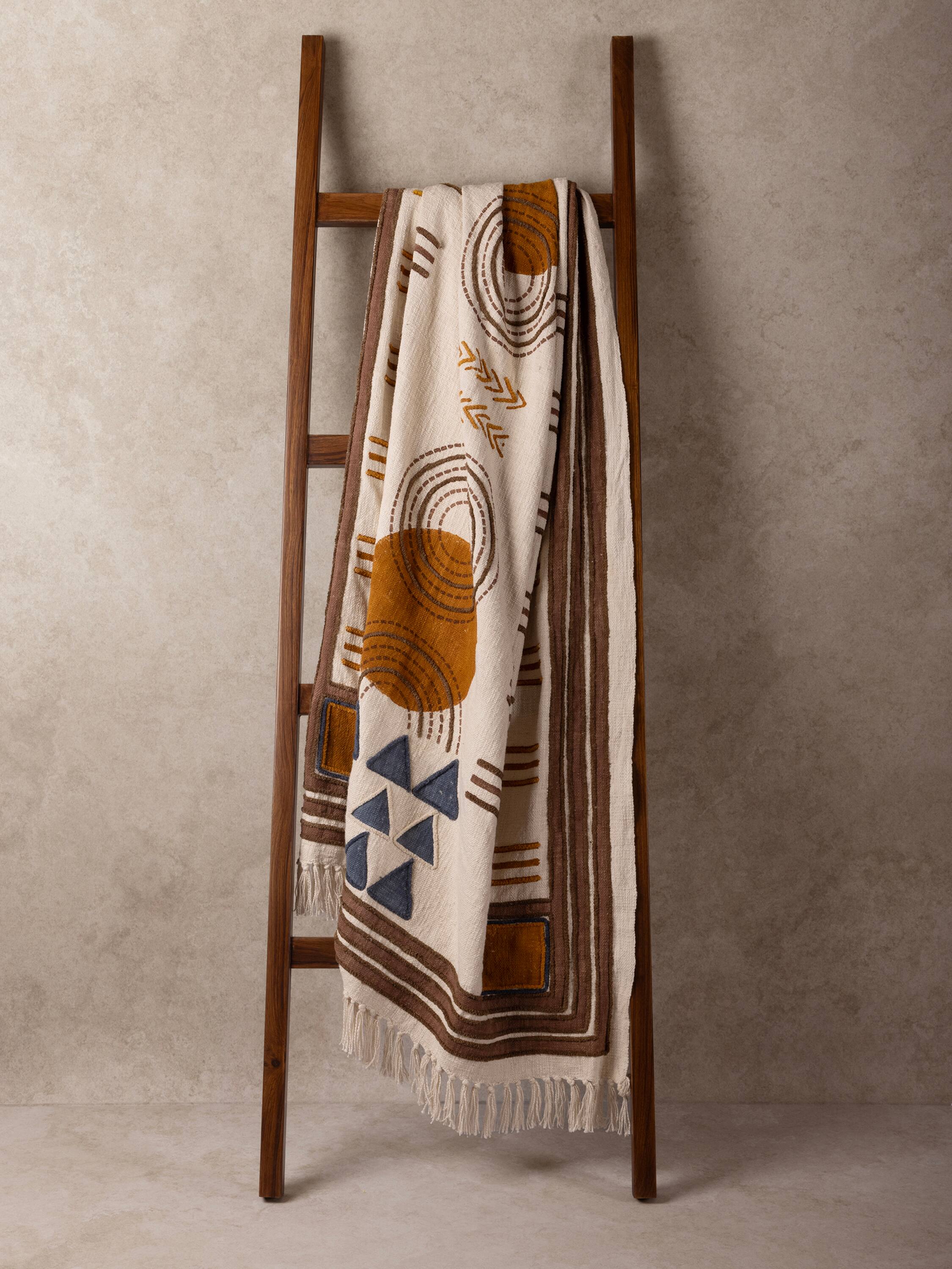 Angle. GAURI KOHLI - Aarya Throw Blanket - Shades of beige, brown and blue.