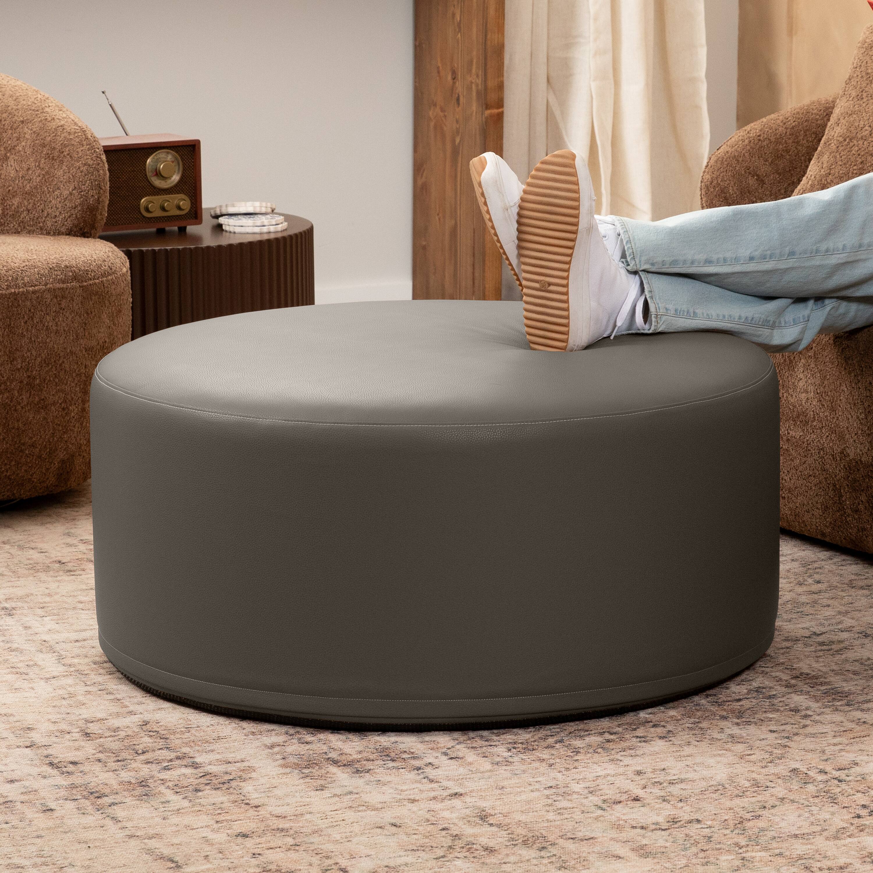 Angle. Jaxx - Jaxx Candler Round Couch Oversized Giant Coffee Table Ottoman, Kid Safe with Removable Cover, Gunmetal - Faux Leather Gunmetal.