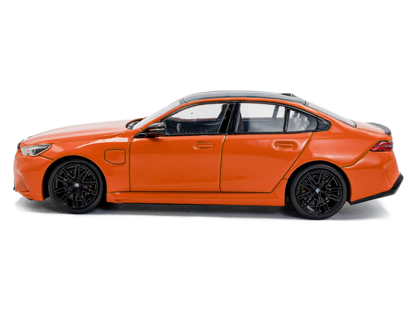 Alt View 1. Solido - 2024 BMW M5 Sedan Fire Orange III with Black Top 1/43 Diecast Model Car by Solido.