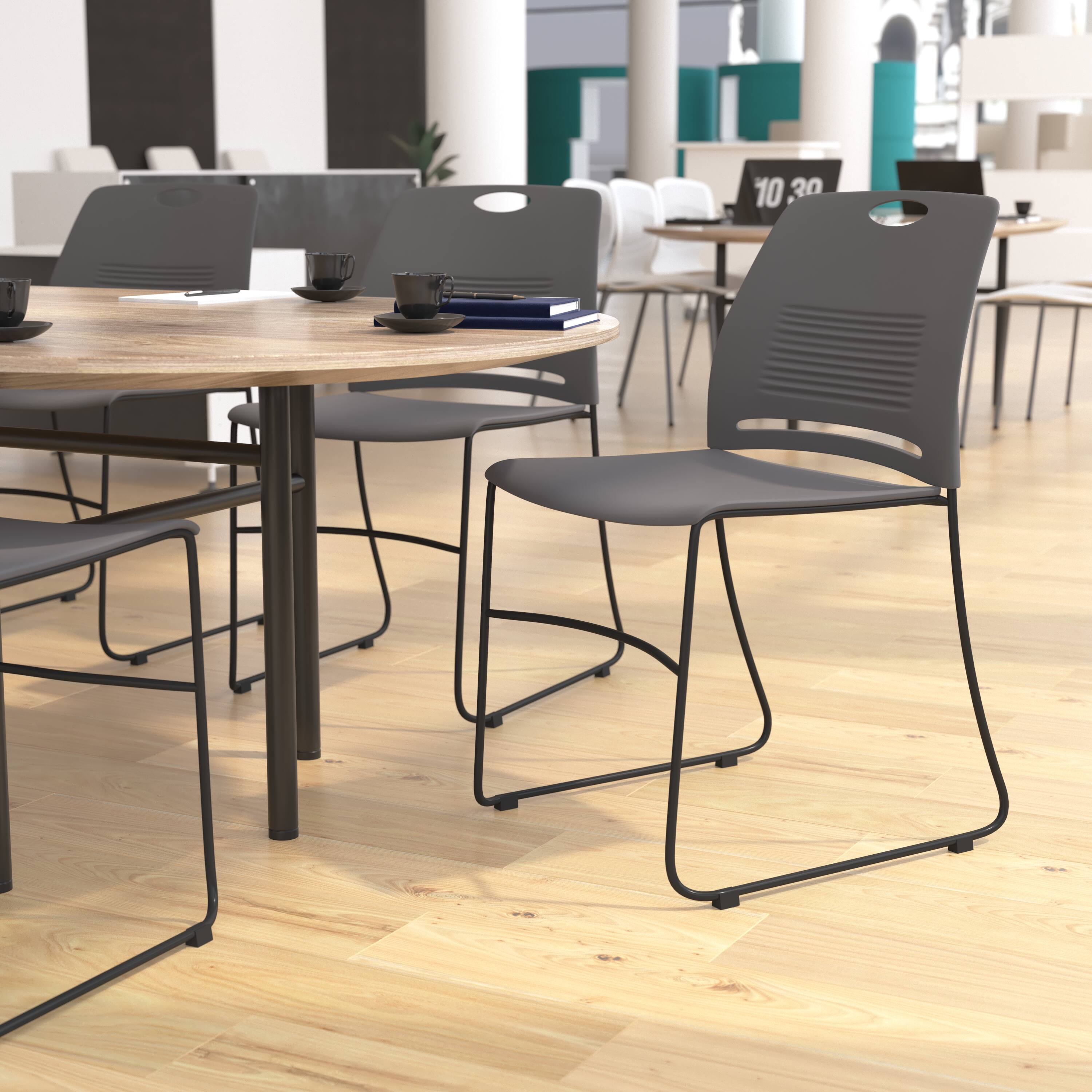 Alt View 2. Emma + Oliver - Heavy Duty 660 lb. Capacity Plastic Stack Chair with Steel Sled Base Frame - Gray.