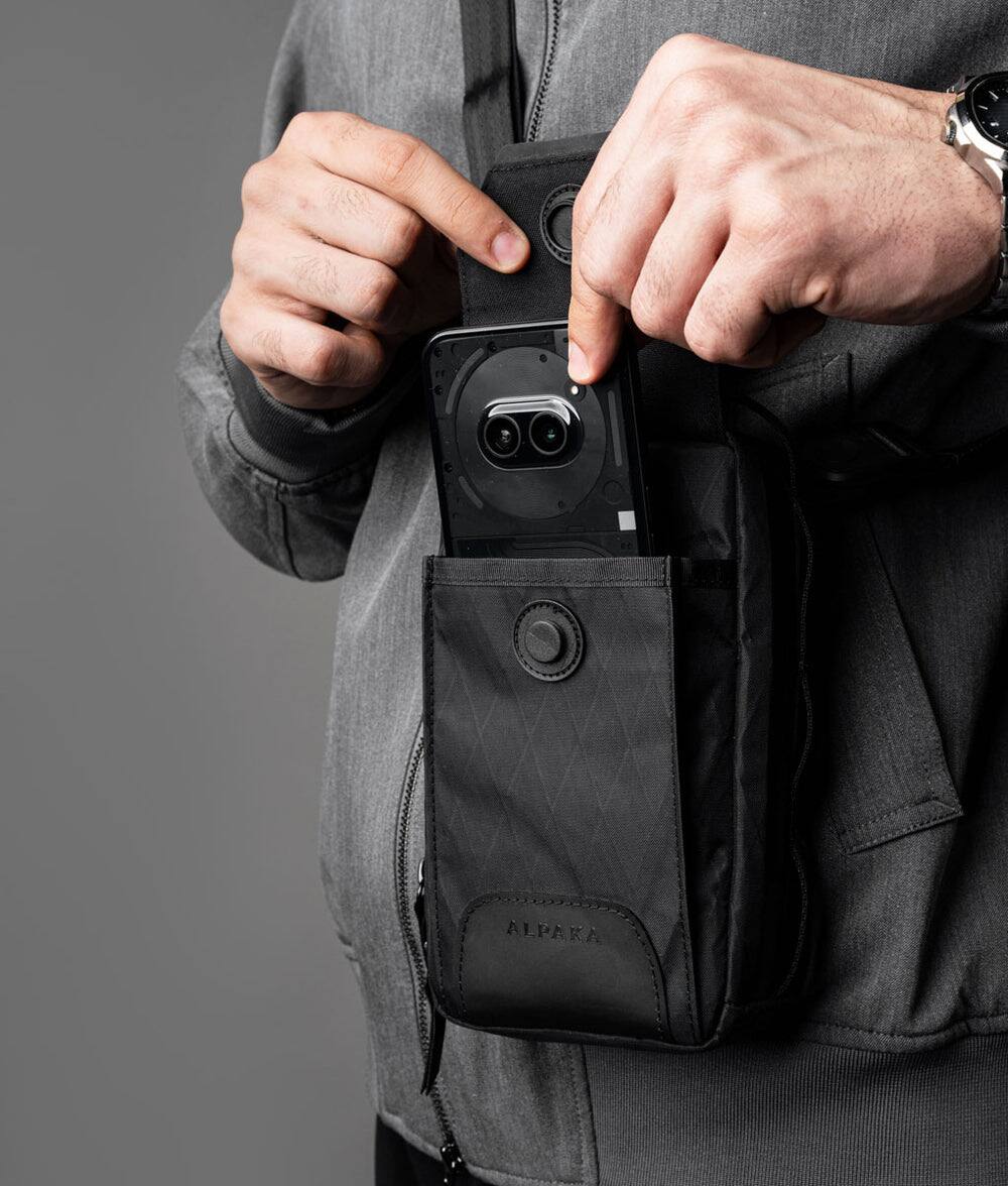 Left. ALPAKA - Modular Sling V2 MIini Sling Bag for Phone, Magnetic Quick Access, EDC Crossbody Bag with Adjustable Strap - Black X-Pac VX21.