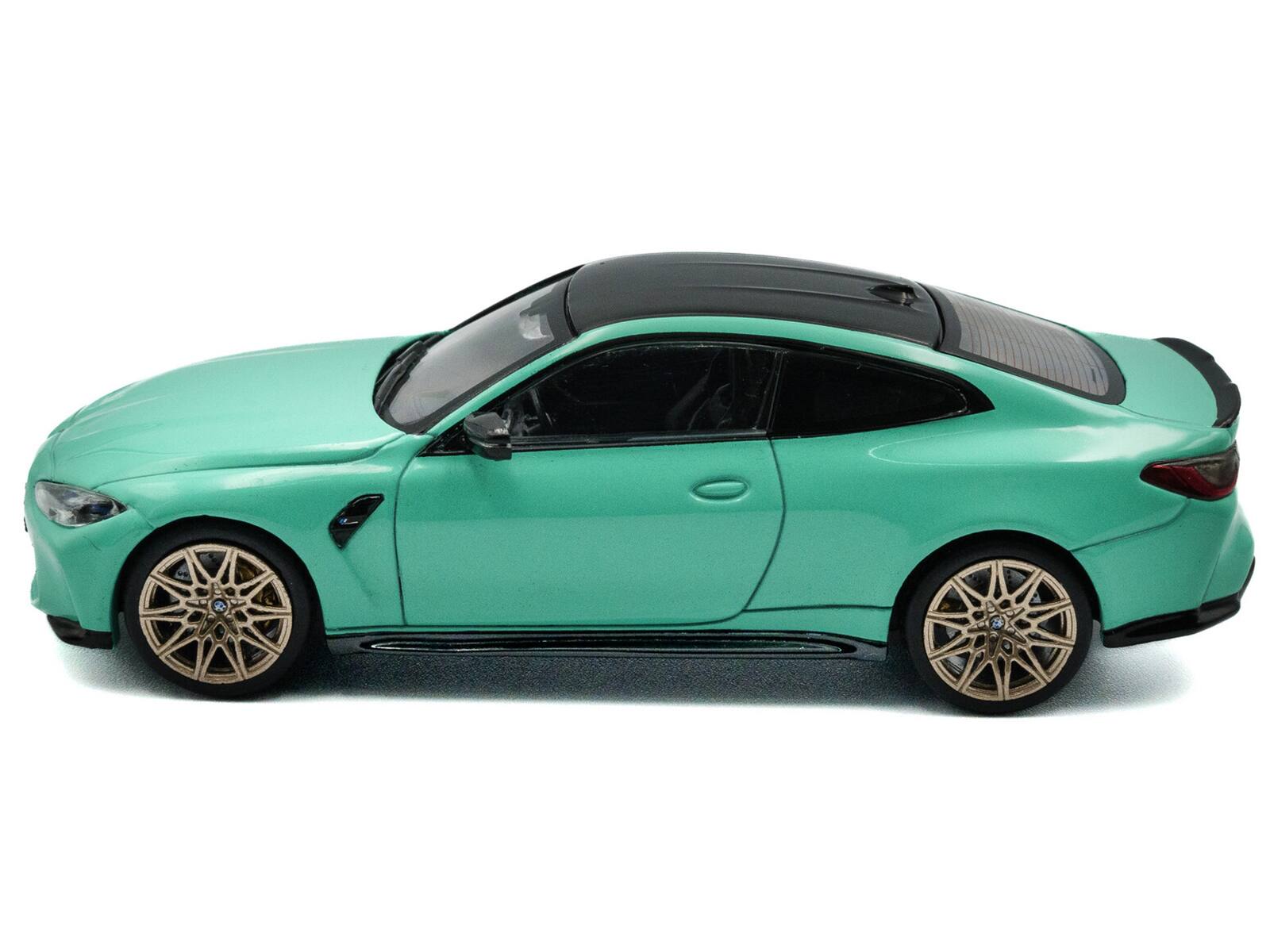 Angle. Solido - 2023 BMW M4 Competition (G82) Mint Green with Black Top 1/43 Diecast Model Car by Solido - Mint Green with Black.