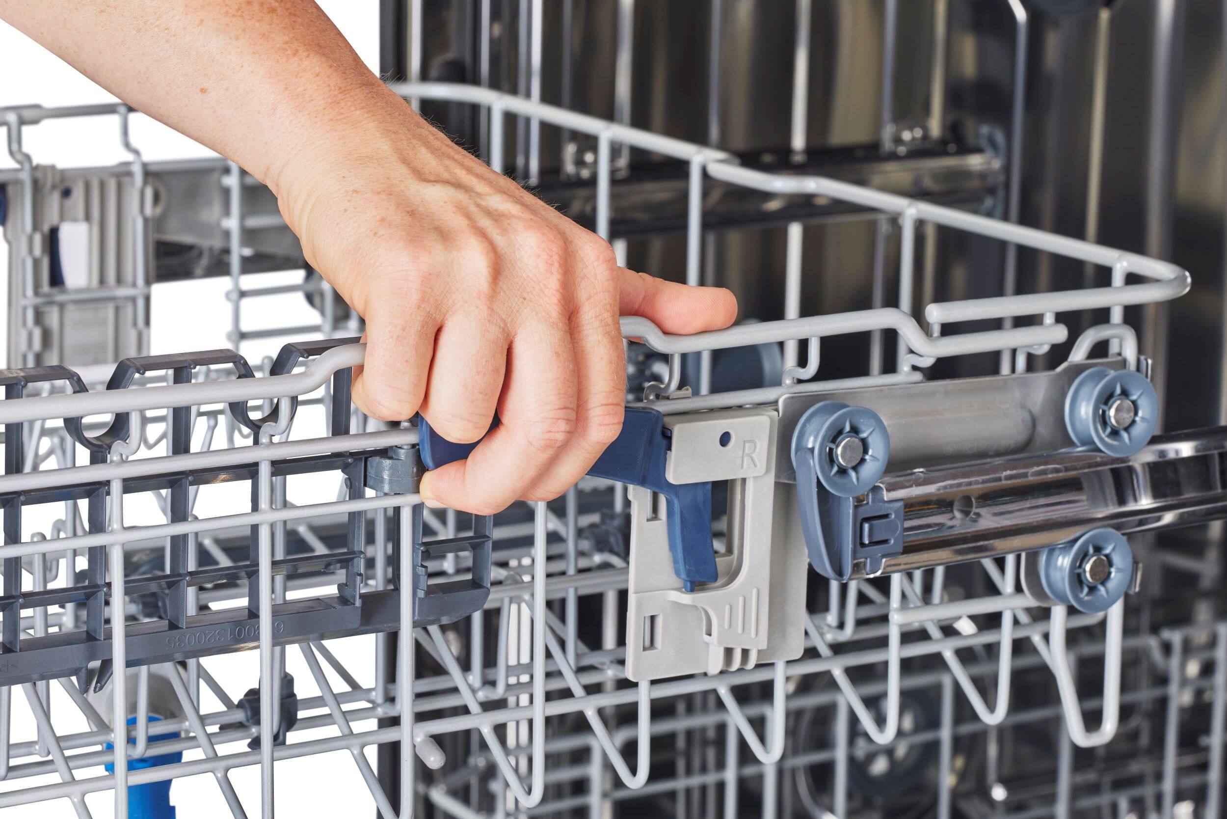 I cannot group or correct the text as it does not seem to be related to the image. The image shows a person holding a dishwasher door handle, and there is no text visible in the image.