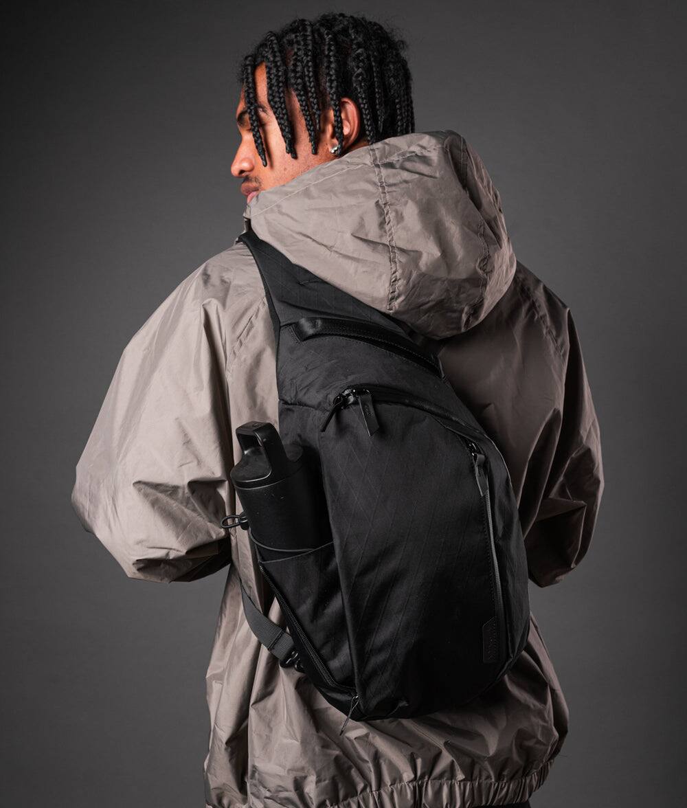 Angle. ALPAKA - Metro Crossbody Left Shoulder Sling Bag Men,Sling Backpack - Fits 11" Tablet - Single Shoulder - Black X-Pac VX42.