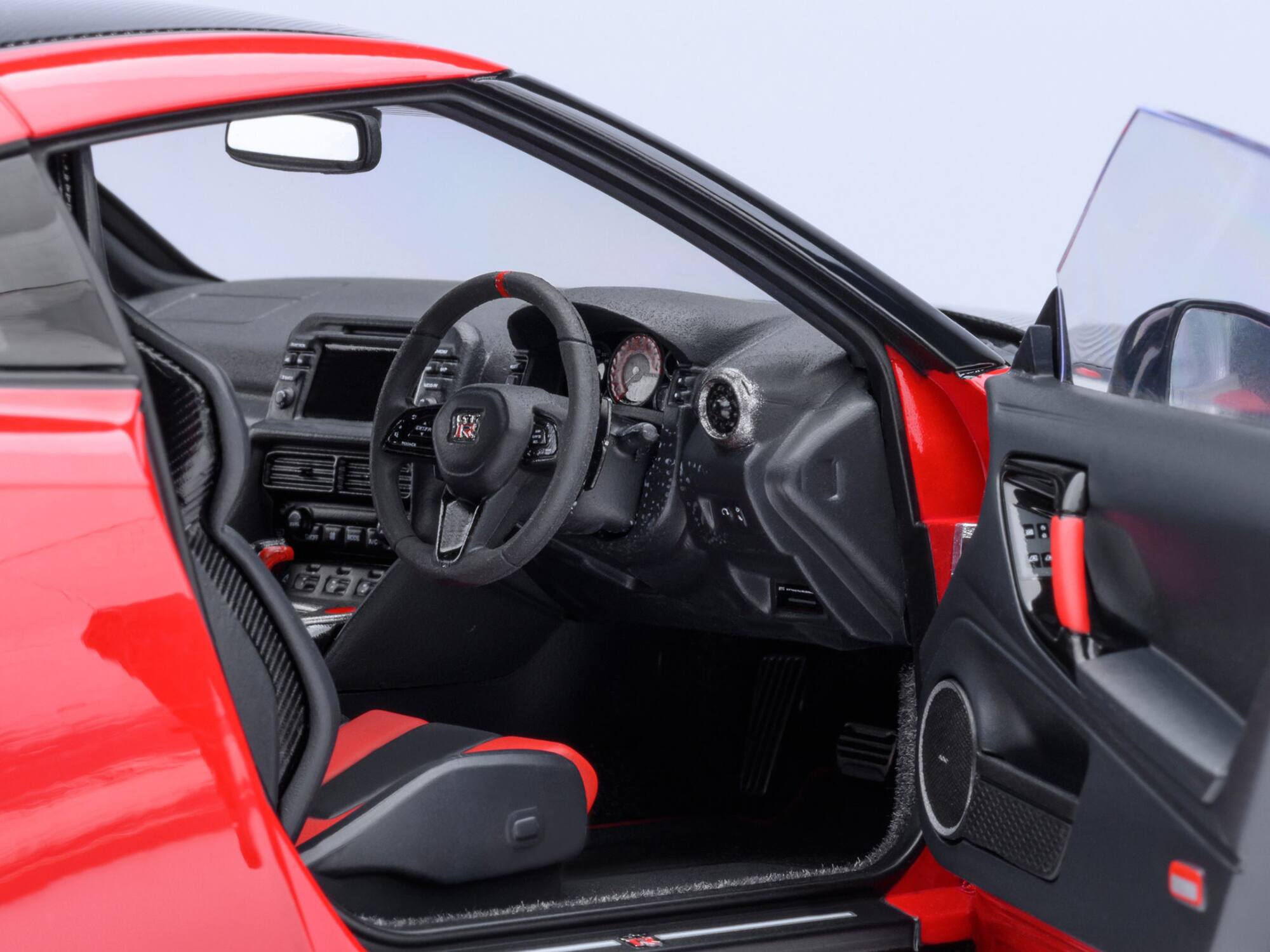 Alt View 2. Autoart - 2022 Nissan GT-R (R35) Nismo Special Edition RHD Vibrant Red with Carbon Hood and Top 1/18 Model Car by Autoart.
