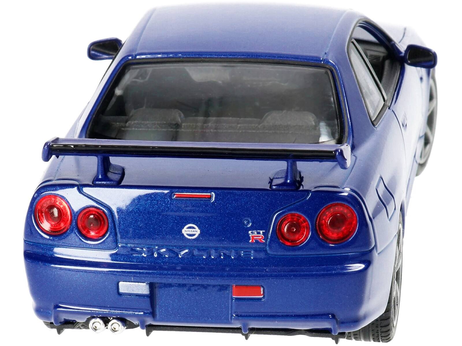 Left. Welly - Nissan Skyline GT-R (R34) RHD (Right Hand Drive) Blue Metallic "NEX Models" 1/24 Diecast Model Car by Welly - Blue Metallic.